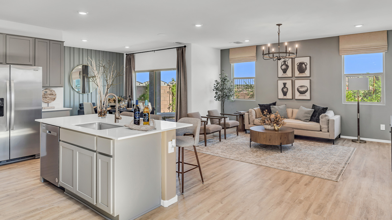 Welcome to The Kate at Coronet at Gladden Farms in Marana, Arizona – a spacious 2,227 sq. ft. two-story home designed to offer both luxury and practicality in a vibrant community setting.  As you step through the welcoming front porch, you’re greeted by an expansive entryway that leads into the heart of the home. The main floor features a generous great room that seamlessly flows into the dining area and kitchen, creating a perfect space for family gatherings and entertaining guests. The kitchen is a chef’s delight, boasting quartz countertops, a large island with a breakfast bar, modern appliances, and a walk-in pantry that provides ample storage.  The main floor also includes a convenient powder room for guests and direct access to the two-car garage, enhancing the home’s functionality. Just off the kitchen and dining room, a covered patio invites you to enjoy the beautiful Arizona weather, offering a serene spot for outdoor dining or relaxation.  Upstairs, the master suite offers a peaceful retreat, complete with a spacious bedroom, a large walk-in closet, and an en-suite bathroom featuring dual vanities and a walk-in shower. The upper level also includes three additional bedrooms, a full bathroom, and a centrally located utility room for added convenience. A versatile loft area provides additional living space, perfect for a playroom, home office, or secondary lounge.  The Kate in Coronet at Gladden Farms is designed with energy efficiency at its core. This DOE Zero Energy Ready Home features advanced energy-saving technologies such as tankless water heaters, energy-efficient LED lighting, and high-performance spray foam insulation, ensuring lower utility costs and a reduced environmental footprint.  Living at Coronet at Gladden Farms means more than just having a beautiful home. Residents enjoy access to 830 acres of green space, 28 parks, 19 playgrounds, and exclusive amenities like a sparkling community pool, fitness center, and clubhouse. The gated community also offers walking trails, a dog park, and close proximity to everyday conveniences, making it an ideal environment for families and active lifestyles.