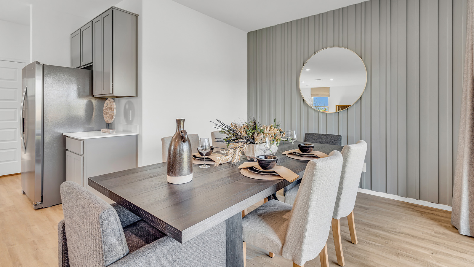 Welcome to The Kate at Coronet at Gladden Farms in Marana, Arizona – a spacious 2,227 sq. ft. two-story home designed to offer both luxury and practicality in a vibrant community setting.  As you step through the welcoming front porch, you’re greeted by an expansive entryway that leads into the heart of the home. The main floor features a generous great room that seamlessly flows into the dining area and kitchen, creating a perfect space for family gatherings and entertaining guests. The kitchen is a chef’s delight, boasting quartz countertops, a large island with a breakfast bar, modern appliances, and a walk-in pantry that provides ample storage.  The main floor also includes a convenient powder room for guests and direct access to the two-car garage, enhancing the home’s functionality. Just off the kitchen and dining room, a covered patio invites you to enjoy the beautiful Arizona weather, offering a serene spot for outdoor dining or relaxation.  Upstairs, the master suite offers a peaceful retreat, complete with a spacious bedroom, a large walk-in closet, and an en-suite bathroom featuring dual vanities and a walk-in shower. The upper level also includes three additional bedrooms, a full bathroom, and a centrally located utility room for added convenience. A versatile loft area provides additional living space, perfect for a playroom, home office, or secondary lounge.  The Kate in Coronet at Gladden Farms is designed with energy efficiency at its core. This DOE Zero Energy Ready Home features advanced energy-saving technologies such as tankless water heaters, energy-efficient LED lighting, and high-performance spray foam insulation, ensuring lower utility costs and a reduced environmental footprint.  Living at Coronet at Gladden Farms means more than just having a beautiful home. Residents enjoy access to 830 acres of green space, 28 parks, 19 playgrounds, and exclusive amenities like a sparkling community pool, fitness center, and clubhouse. The gated community also offers walking trails, a dog park, and close proximity to everyday conveniences, making it an ideal environment for families and active lifestyles.