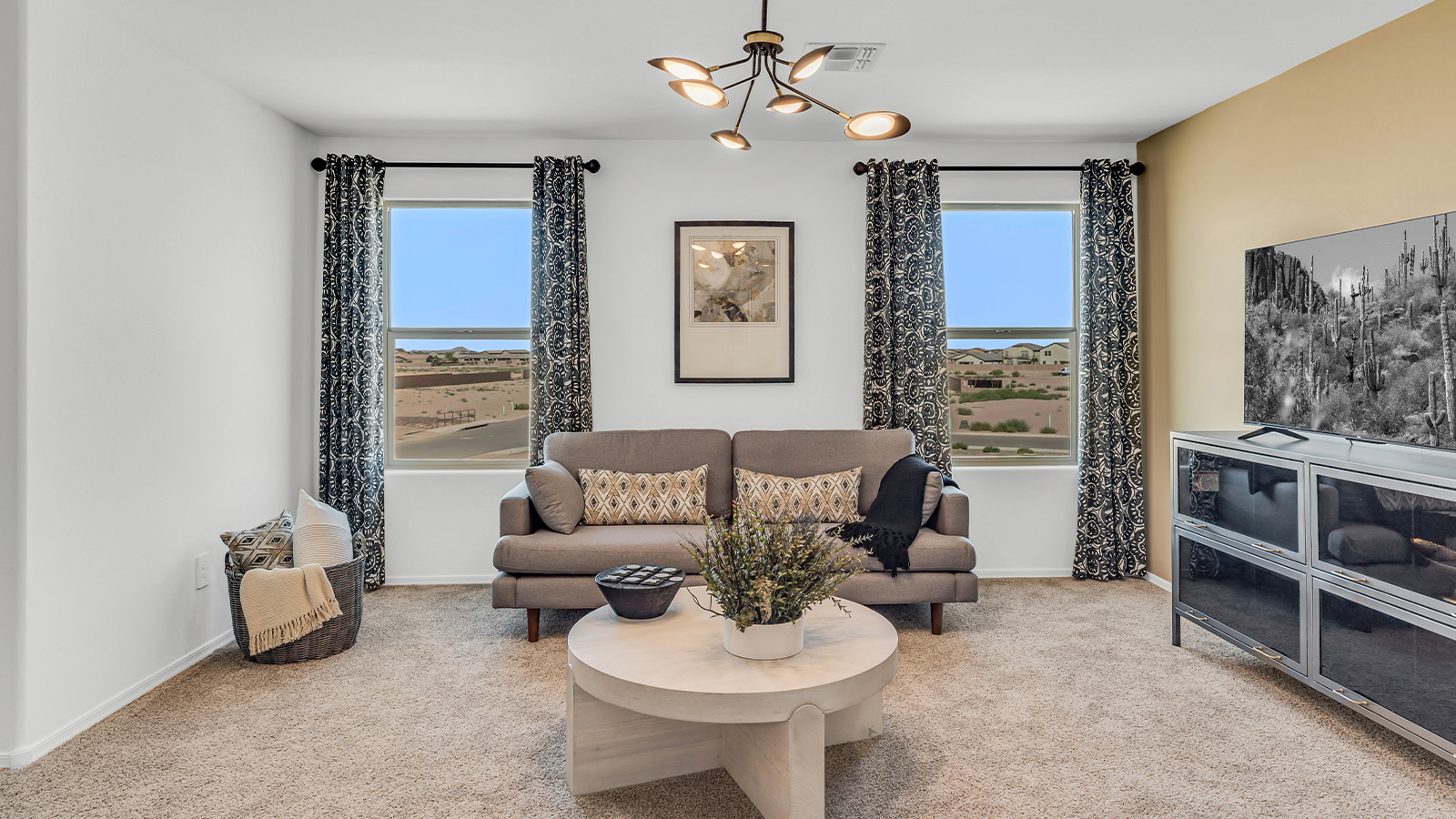 Welcome to The Kate at Coronet at Gladden Farms in Marana, Arizona – a spacious 2,227 sq. ft. two-story home designed to offer both luxury and practicality in a vibrant community setting.  As you step through the welcoming front porch, you’re greeted by an expansive entryway that leads into the heart of the home. The main floor features a generous great room that seamlessly flows into the dining area and kitchen, creating a perfect space for family gatherings and entertaining guests. The kitchen is a chef’s delight, boasting quartz countertops, a large island with a breakfast bar, modern appliances, and a walk-in pantry that provides ample storage.  The main floor also includes a convenient powder room for guests and direct access to the two-car garage, enhancing the home’s functionality. Just off the kitchen and dining room, a covered patio invites you to enjoy the beautiful Arizona weather, offering a serene spot for outdoor dining or relaxation.  Upstairs, the master suite offers a peaceful retreat, complete with a spacious bedroom, a large walk-in closet, and an en-suite bathroom featuring dual vanities and a walk-in shower. The upper level also includes three additional bedrooms, a full bathroom, and a centrally located utility room for added convenience. A versatile loft area provides additional living space, perfect for a playroom, home office, or secondary lounge.  The Kate in Coronet at Gladden Farms is designed with energy efficiency at its core. This DOE Zero Energy Ready Home features advanced energy-saving technologies such as tankless water heaters, energy-efficient LED lighting, and high-performance spray foam insulation, ensuring lower utility costs and a reduced environmental footprint.  Living at Coronet at Gladden Farms means more than just having a beautiful home. Residents enjoy access to 830 acres of green space, 28 parks, 19 playgrounds, and exclusive amenities like a sparkling community pool, fitness center, and clubhouse. The gated community also offers walking trails, a dog park, and close proximity to everyday conveniences, making it an ideal environment for families and active lifestyles.