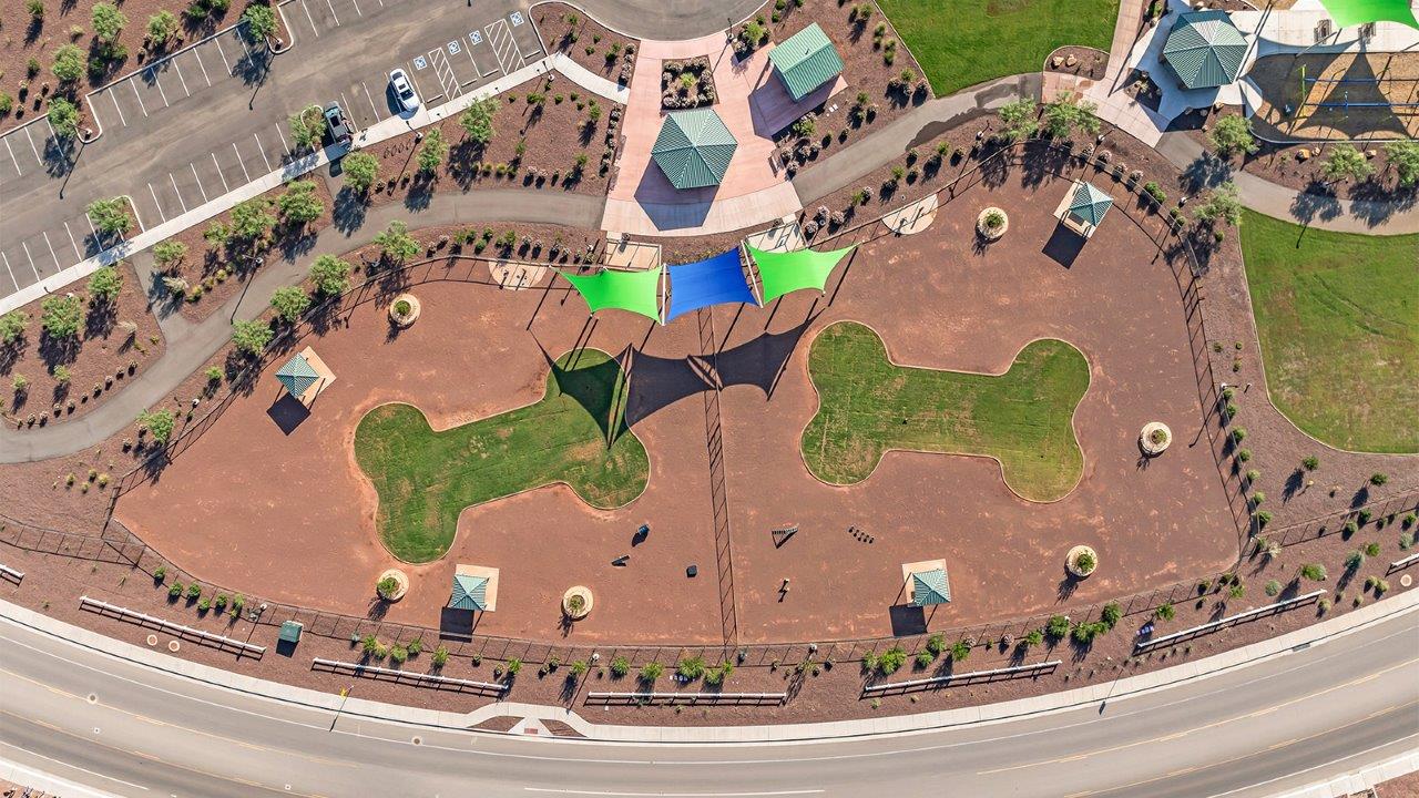 Welcome to The Kate at Coronet at Gladden Farms in Marana, Arizona – a spacious 2,227 sq. ft. two-story home designed to offer both luxury and practicality in a vibrant community setting.  As you step through the welcoming front porch, you’re greeted by an expansive entryway that leads into the heart of the home. The main floor features a generous great room that seamlessly flows into the dining area and kitchen, creating a perfect space for family gatherings and entertaining guests. The kitchen is a chef’s delight, boasting quartz countertops, a large island with a breakfast bar, modern appliances, and a walk-in pantry that provides ample storage.  The main floor also includes a convenient powder room for guests and direct access to the two-car garage, enhancing the home’s functionality. Just off the kitchen and dining room, a covered patio invites you to enjoy the beautiful Arizona weather, offering a serene spot for outdoor dining or relaxation.  Upstairs, the master suite offers a peaceful retreat, complete with a spacious bedroom, a large walk-in closet, and an en-suite bathroom featuring dual vanities and a walk-in shower. The upper level also includes three additional bedrooms, a full bathroom, and a centrally located utility room for added convenience. A versatile loft area provides additional living space, perfect for a playroom, home office, or secondary lounge.  The Kate in Coronet at Gladden Farms is designed with energy efficiency at its core. This DOE Zero Energy Ready Home features advanced energy-saving technologies such as tankless water heaters, energy-efficient LED lighting, and high-performance spray foam insulation, ensuring lower utility costs and a reduced environmental footprint.  Living at Coronet at Gladden Farms means more than just having a beautiful home. Residents enjoy access to 830 acres of green space, 28 parks, 19 playgrounds, and exclusive amenities like a sparkling community pool, fitness center, and clubhouse. The gated community also offers walking trails, a dog park, and close proximity to everyday conveniences, making it an ideal environment for families and active lifestyles.