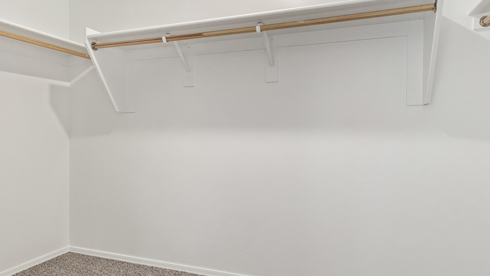 Welcome to The Madison within Coronet at Gladden Farms in Marana, Arizona – the largest new home in the community, offering an expansive 2,542 sq. ft. of living space designed to meet the needs of modern families.  As you step through the front porch, you’re welcomed into an entryway that opens up to the heart of the home. The main floor features a spacious great room that flows seamlessly into the dining area and kitchen, making it an ideal space for family gatherings and entertaining. The kitchen is a standout with its quartz countertops, large island, modern appliances, and a walk-in pantry.  On the main level, you'll also find a convenient bedroom and full bathroom, perfect for guests or as a private office space. The main floor’s design ensures both comfort and functionality, with direct access to the two-car garage and a covered patio that extends your living space outdoors.  Upstairs, the master suite offers a true retreat. The spacious bedroom leads to a large walk-in closet and an en-suite bathroom featuring dual vanities and a walk-in shower. The upper level also includes three additional bedrooms, a full bathroom, and a versatile loft area that can serve as a game room, home office, or second living area. A centrally located utility room adds convenience to everyday living.  Living at Coronet at Gladden Farms offers more than just a beautiful home. Residents enjoy exclusive amenities like a sparkling community pool, jacuzzi, fitness center, and clubhouse, along with access to 830 acres of green space, parks, playgrounds, and walking trails. This community is perfect for families who appreciate both comfort and outdoor adventure.  The Madison at Coronet at Gladden Farms is built with energy efficiency in mind, meeting DOE Zero Energy Ready Home standards. This means advanced features like tankless water heaters, energy-efficient LED lighting, and high-performance insulation are standard, ensuring lower utility costs and a reduced environmental footprint.