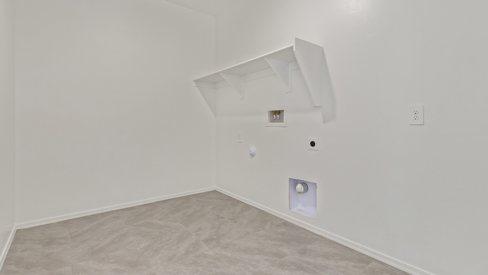 Welcome to The Madison within Coronet at Gladden Farms in Marana, Arizona – the largest new home in the community, offering an expansive 2,542 sq. ft. of living space designed to meet the needs of modern families.  As you step through the front porch, you’re welcomed into an entryway that opens up to the heart of the home. The main floor features a spacious great room that flows seamlessly into the dining area and kitchen, making it an ideal space for family gatherings and entertaining. The kitchen is a standout with its quartz countertops, large island, modern appliances, and a walk-in pantry.  On the main level, you'll also find a convenient bedroom and full bathroom, perfect for guests or as a private office space. The main floor’s design ensures both comfort and functionality, with direct access to the two-car garage and a covered patio that extends your living space outdoors.  Upstairs, the master suite offers a true retreat. The spacious bedroom leads to a large walk-in closet and an en-suite bathroom featuring dual vanities and a walk-in shower. The upper level also includes three additional bedrooms, a full bathroom, and a versatile loft area that can serve as a game room, home office, or second living area. A centrally located utility room adds convenience to everyday living.  Living at Coronet at Gladden Farms offers more than just a beautiful home. Residents enjoy exclusive amenities like a sparkling community pool, jacuzzi, fitness center, and clubhouse, along with access to 830 acres of green space, parks, playgrounds, and walking trails. This community is perfect for families who appreciate both comfort and outdoor adventure.  The Madison at Coronet at Gladden Farms is built with energy efficiency in mind, meeting DOE Zero Energy Ready Home standards. This means advanced features like tankless water heaters, energy-efficient LED lighting, and high-performance insulation are standard, ensuring lower utility costs and a reduced environmental footprint.