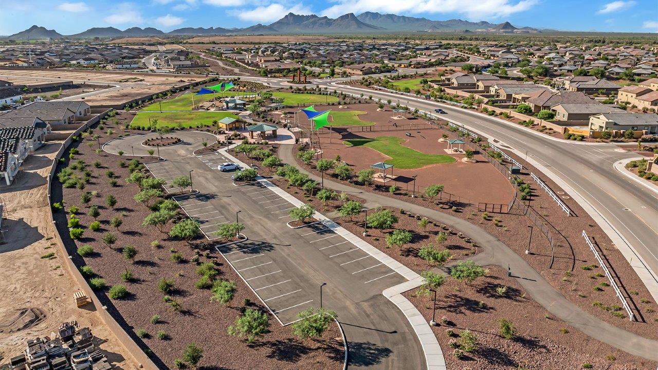 Welcome to The Madison within Coronet at Gladden Farms in Marana, Arizona – the largest new home in the community, offering an expansive 2,542 sq. ft. of living space designed to meet the needs of modern families.  As you step through the front porch, you’re welcomed into an entryway that opens up to the heart of the home. The main floor features a spacious great room that flows seamlessly into the dining area and kitchen, making it an ideal space for family gatherings and entertaining. The kitchen is a standout with its quartz countertops, large island, modern appliances, and a walk-in pantry.  On the main level, you'll also find a convenient bedroom and full bathroom, perfect for guests or as a private office space. The main floor’s design ensures both comfort and functionality, with direct access to the two-car garage and a covered patio that extends your living space outdoors.  Upstairs, the master suite offers a true retreat. The spacious bedroom leads to a large walk-in closet and an en-suite bathroom featuring dual vanities and a walk-in shower. The upper level also includes three additional bedrooms, a full bathroom, and a versatile loft area that can serve as a game room, home office, or second living area. A centrally located utility room adds convenience to everyday living.  Living at Coronet at Gladden Farms offers more than just a beautiful home. Residents enjoy exclusive amenities like a sparkling community pool, jacuzzi, fitness center, and clubhouse, along with access to 830 acres of green space, parks, playgrounds, and walking trails. This community is perfect for families who appreciate both comfort and outdoor adventure.  The Madison at Coronet at Gladden Farms is built with energy efficiency in mind, meeting DOE Zero Energy Ready Home standards. This means advanced features like tankless water heaters, energy-efficient LED lighting, and high-performance insulation are standard, ensuring lower utility costs and a reduced environmental footprint.