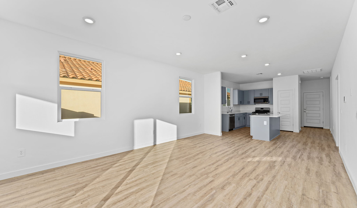 Welcome to The Aloe, a thoughtfully designed new floor plan within Coronet at Gladden Farms Community in Marana, Arizona. Offering 1,310 square feet of efficient and comfortable living space, The Aloe is ideal for those seeking a home that blends functionality, modern style, and everyday ease.  Upon entry, you’re welcomed into an open-concept layout that maximizes every square foot. The large great room serves as the heart of the home and flows seamlessly into the dining area and kitchen, perfect for both relaxing and entertaining. The kitchen offers a clean and modern aesthetic with ample storage and workspace.  The Aloe features three well-proportioned bedrooms designed for comfort and flexibility. The private primary suite is tucked away at the rear of the home and includes a walk-in closet and en-suite bathroom. Two additional bedrooms are located near the front of the home.  Designed with convenience in mind, the home includes a utility room near the kitchen, offering easy access to laundry and additional storage.  Living at Coronet at Gladden Farms means enjoying a community that values both comfort and outdoor adventure. With access to 830 acres of green space, parks, playgrounds, and exclusive amenities like a sparkling pool, fitness center, and clubhouse, this community is perfect for families and active lifestyles.  *Images shown are for reference only. They depict The Aloe spec home and may not represent the actual home.