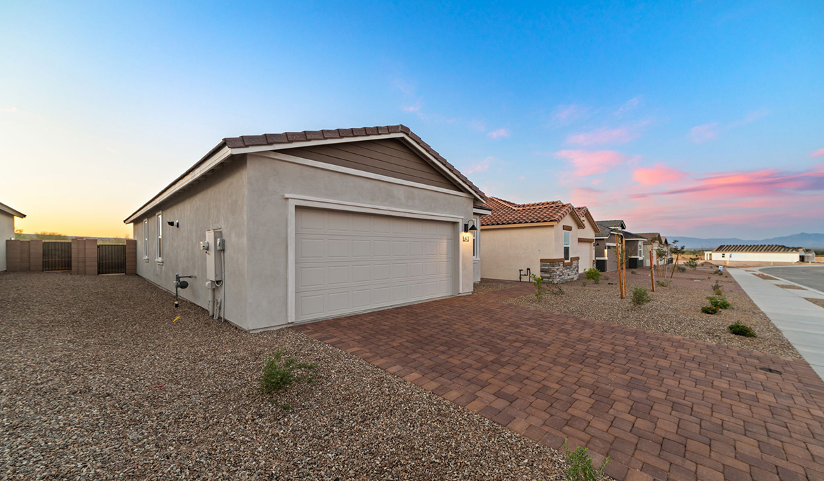 Welcome to The Aloe, a thoughtfully designed new floor plan within Coronet at Gladden Farms Community in Marana, Arizona. Offering 1,310 square feet of efficient and comfortable living space, The Aloe is ideal for those seeking a home that blends functionality, modern style, and everyday ease.  Upon entry, you’re welcomed into an open-concept layout that maximizes every square foot. The large great room serves as the heart of the home and flows seamlessly into the dining area and kitchen, perfect for both relaxing and entertaining. The kitchen offers a clean and modern aesthetic with ample storage and workspace.  The Aloe features three well-proportioned bedrooms designed for comfort and flexibility. The private primary suite is tucked away at the rear of the home and includes a walk-in closet and en-suite bathroom. Two additional bedrooms are located near the front of the home.  Designed with convenience in mind, the home includes a utility room near the kitchen, offering easy access to laundry and additional storage.  Living at Coronet at Gladden Farms means enjoying a community that values both comfort and outdoor adventure. With access to 830 acres of green space, parks, playgrounds, and exclusive amenities like a sparkling pool, fitness center, and clubhouse, this community is perfect for families and active lifestyles.  *Images shown are for reference only. They depict The Aloe spec home and may not represent the actual home.