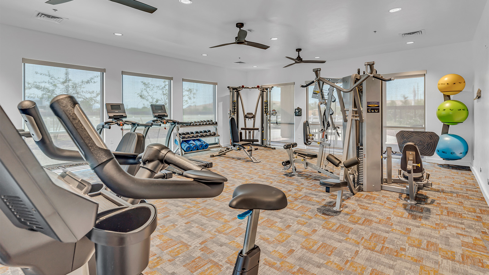 Welcome to The Aloe, a thoughtfully designed new floor plan within Coronet at Gladden Farms Community in Marana, Arizona. Offering 1,310 square feet of efficient and comfortable living space, The Aloe is ideal for those seeking a home that blends functionality, modern style, and everyday ease.  Upon entry, you’re welcomed into an open-concept layout that maximizes every square foot. The large great room serves as the heart of the home and flows seamlessly into the dining area and kitchen—perfect for both relaxing and entertaining. The kitchen is beautifully appointed with a central island, quartz countertops, Shaker-style cabinetry, and a dedicated pantry, creating a clean, modern aesthetic with ample storage and workspace.  The Aloe features three well-proportioned bedrooms designed for comfort and flexibility. The private primary suite is tucked away at the rear of the home and includes a walk-in closet and en-suite bathroom. Two additional bedrooms are located near the front of the home.  Designed with convenience in mind, the home includes a utility room near the kitchen, offering easy access to laundry and additional storage. A covered back patio extends the living space outdoors, providing the perfect setting to enjoy Gladden Farms beautiful weather and scenic surroundings.  Living at Coronet at Gladden Farms means enjoying a community that values both comfort and outdoor adventure. With access to 830 acres of green space, parks, playgrounds, and exclusive amenities like a sparkling pool, fitness center, and clubhouse, this community is perfect for families and active lifestyles.