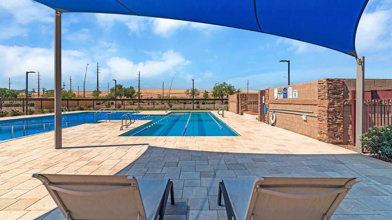 Introducing the Elm floor plan, a thoughtfully designed two-story home now available within Coronet at Gladden Farms Community in Marana, Arizona. With 1,775 square feet of modern living space, the Elm is perfect for those seeking a cozy yet highly functional home that offers a smart separation between the private second-floor retreat and the main living areas below.  Step through the inviting front porch into a welcoming entryway that opens into the main first floor, designed to maximize every inch of space. The expansive great room flows into the dining area and kitchen, creating an ideal layout for entertaining and everyday living. The kitchen features a central island, quartz countertops, Shaker-style cabinetry, and walk-in pantry. A conveniently located powder room completes the first floor. This home features a finished two-car garage accessible from the main floor.  Upstairs, the Elm offers four spacious bedrooms each with a generous closet. The primary suite provides a peaceful retreat with a walk-in closet and en-suite bathroom. The three additional bedrooms are situated just off the versatile loft area, ideal for an extra living space, game room, or home office. Everyday convenience is built in, with the laundry room and a full secondary bathroom also located on the second floor.  The Elm is designed with energy efficiency in mind. This DOE Zero Energy Ready Home offers a sustainable lifestyle with advanced features like tankless water heaters, energy-efficient LED lighting, and high-performance insulation, ensuring lower utility costs and a reduced environmental footprint.  Living at Coronet at Gladden Farms means enjoying a community that values both comfort and outdoor adventure. With access to 830 acres of green space, parks, playgrounds, and exclusive amenities like a sparkling pool, fitness center, and clubhouse, this community is perfect for families and active lifestyles.