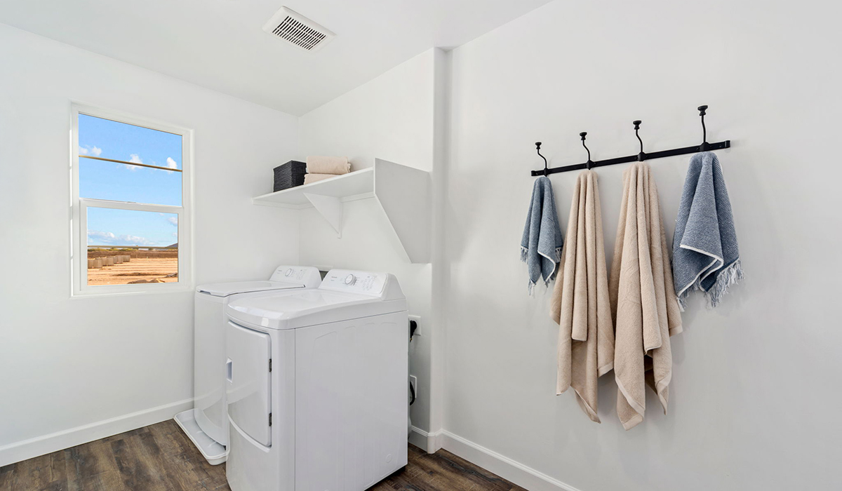 Discover the Gila, a brand new versatile two-story floor plan offering 2,057 sq. ft. of comfortable, modern living space available now within Coronet at Gladden Farms Community in Marana, Arizona.  Thoughtfully crafted for households of all sizes, the Gila features four bedrooms, a spacious loft, and three full bathrooms, ensuring every family member has their own space to unwind and recharge.  A standout highlight of this home is the guest-style suite on the main floor, offering convenient access to a full bathroom. Perfect for visitors, multi-generational living, or private home office, this main-level bedroom offers exceptional flexibility.  The main floor creates an inviting flow, with a generous great room that connects seamlessly to the dining area and kitchen. The kitchen features a large center island, Shaker-style cabinetry, and ample storage space to include a large pantry.  Upstairs, the Gila continues to impress with thoughtful design and family-friendly layout. The well-appointed primary bedroom includes a private en-suite bathroom and large walk-in closet. Bedrooms 2 and 3, along with the loft, share a full bathroom conveniently located for easy access. An additional standout feature is Bedroom 2, which includes a large walk-in closet—a perfect setup for teens, young adults, or anyone who appreciates extra storage and personal space. The second floor also features a large laundry room, conveniently located near the bedrooms.  The Gila is designed with energy efficiency in mind. This DOE Zero Energy Ready Home offers a sustainable lifestyle with advanced features like tankless water heaters, energy-efficient LED lighting, and high-performance insulation, ensuring lower utility costs and a reduced environmental footprint.  Living at Coronet at Gladden Farms means enjoying a community that values both comfort and outdoor adventure. With access to 830 acres of green space, parks, playgrounds, and exclusive amenities like a sparkling pool, fitness center, and clubhouse, this community is perfect for families and active lifestyles.  *Images shown are for reference only. They depict the Gila model home and may not represent the actual home.