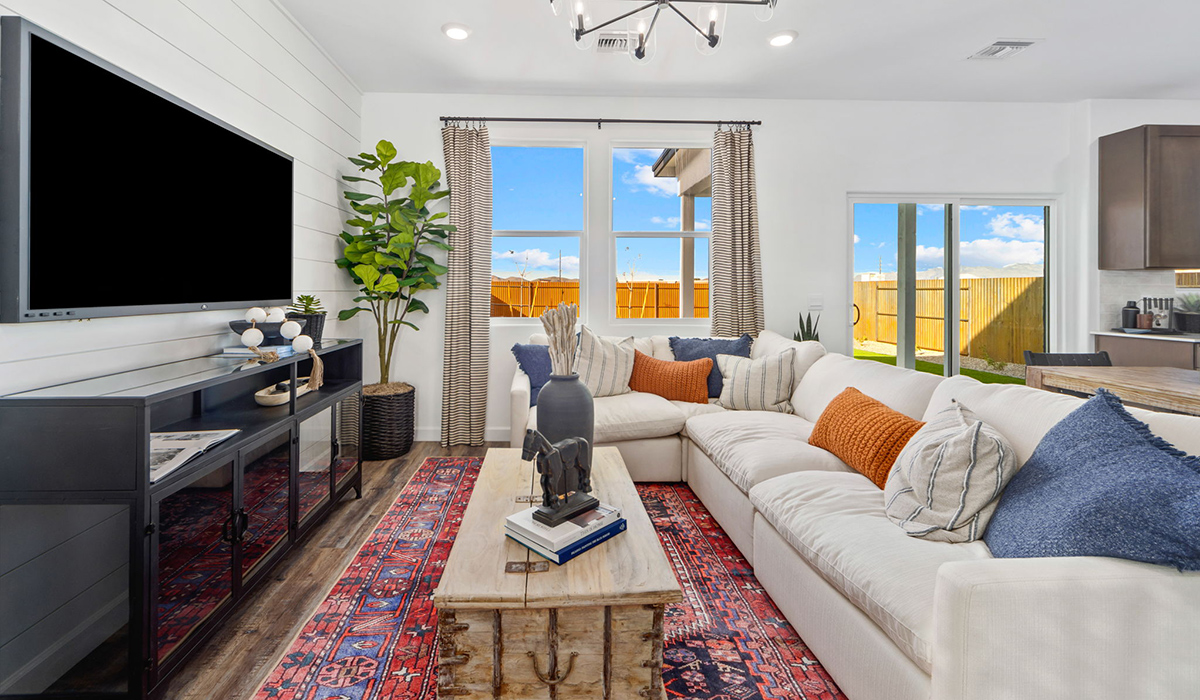 Discover the Gila, a brand new versatile two-story floor plan offering 2,057 sq. ft. of comfortable, modern living space available now within Coronet at Gladden Farms Community in Marana, Arizona.  Thoughtfully crafted for households of all sizes, the Gila features four bedrooms, a spacious loft, and three full bathrooms, ensuring every family member has their own space to unwind and recharge.  A standout highlight of this home is the guest-style suite on the main floor, offering convenient access to a full bathroom. Perfect for visitors, multi-generational living, or private home office, this main-level bedroom offers exceptional flexibility.  The main floor creates an inviting flow, with a generous great room that connects seamlessly to the dining area and kitchen. The kitchen features a large center island, Shaker-style cabinetry, and ample storage space to include a large pantry.  Upstairs, the Gila continues to impress with thoughtful design and family-friendly layout. The well-appointed primary bedroom includes a private en-suite bathroom and large walk-in closet. Bedrooms 2 and 3, along with the loft, share a full bathroom conveniently located for easy access. An additional standout feature is Bedroom 2, which includes a large walk-in closet—a perfect setup for teens, young adults, or anyone who appreciates extra storage and personal space. The second floor also features a large laundry room, conveniently located near the bedrooms.  The Gila is designed with energy efficiency in mind. This DOE Zero Energy Ready Home offers a sustainable lifestyle with advanced features like tankless water heaters, energy-efficient LED lighting, and high-performance insulation, ensuring lower utility costs and a reduced environmental footprint.  Living at Coronet at Gladden Farms means enjoying a community that values both comfort and outdoor adventure. With access to 830 acres of green space, parks, playgrounds, and exclusive amenities like a sparkling pool, fitness center, and clubhouse, this community is perfect for families and active lifestyles.  *Images shown are for reference only. They depict the Gila model home and may not represent the actual home.