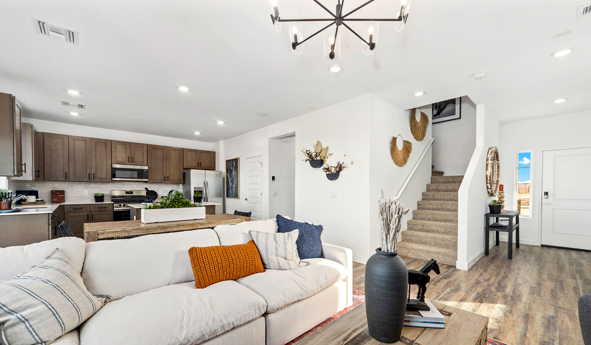 Discover the Gila, a brand new versatile two-story floor plan offering 2,057 sq. ft. of comfortable, modern living space available now within Coronet at Gladden Farms Community in Marana, Arizona.  Thoughtfully crafted for households of all sizes, the Gila features four bedrooms, a spacious loft, and three full bathrooms, ensuring every family member has their own space to unwind and recharge.  A standout highlight of this home is the guest-style suite on the main floor, offering convenient access to a full bathroom. Perfect for visitors, multi-generational living, or private home office, this main-level bedroom offers exceptional flexibility.  The main floor creates an inviting flow, with a generous great room that connects seamlessly to the dining area and kitchen. The kitchen features a large center island, Shaker-style cabinetry, and ample storage space to include a large pantry.  Upstairs, the Gila continues to impress with thoughtful design and family-friendly layout. The well-appointed primary bedroom includes a private en-suite bathroom and large walk-in closet. Bedrooms 2 and 3, along with the loft, share a full bathroom conveniently located for easy access. An additional standout feature is Bedroom 2, which includes a large walk-in closet—a perfect setup for teens, young adults, or anyone who appreciates extra storage and personal space. The second floor also features a large laundry room, conveniently located near the bedrooms.  The Gila is designed with energy efficiency in mind. This DOE Zero Energy Ready Home offers a sustainable lifestyle with advanced features like tankless water heaters, energy-efficient LED lighting, and high-performance insulation, ensuring lower utility costs and a reduced environmental footprint.  Living at Coronet at Gladden Farms means enjoying a community that values both comfort and outdoor adventure. With access to 830 acres of green space, parks, playgrounds, and exclusive amenities like a sparkling pool, fitness center, and clubhouse, this community is perfect for families and active lifestyles.  *Images shown are for reference only. They depict the Gila model home and may not represent the actual home.