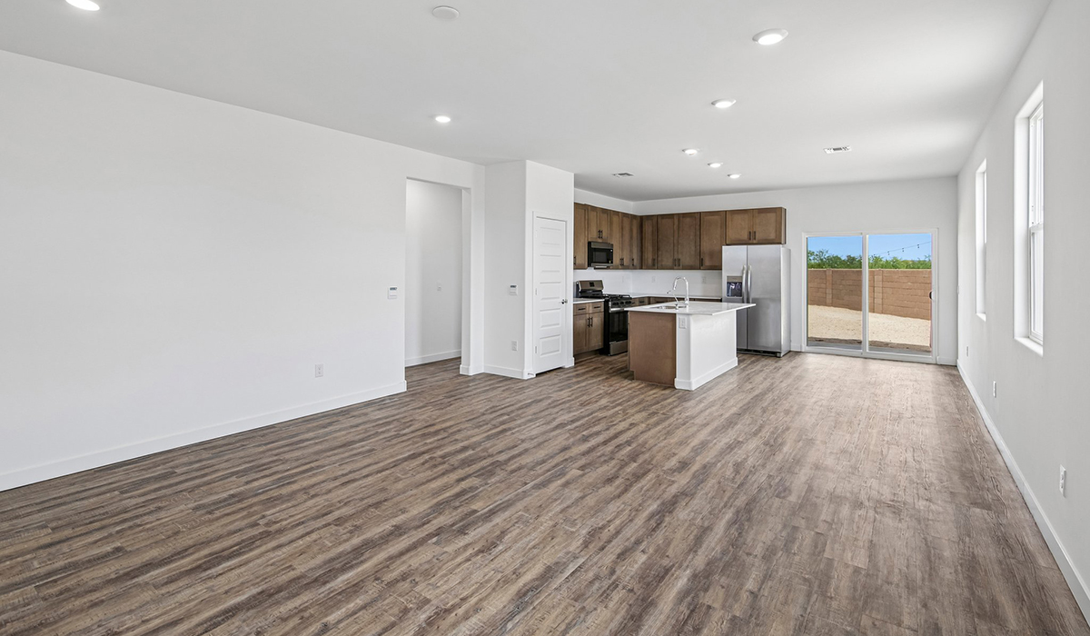 Introducing The Kleindale, a brand new stunning two-story home within the master-planned Coronet at Gladden Farms Community in Marana, Arizona.  This spacious and beautifully designed two-story home offers 2,406 sq. ft., five bedrooms, three full bathrooms, and versatile 2-3 tandem car garage. This impressive layout is ideal for large households, multigenerational living, or anyone who simply wants room to grow, gather, and live comfortably.  A welcoming front porch leads you into the entryway, which flows into the expansive open-concept great room, dining area, and kitchen. The kitchen features stainless steel gas range, microwave, and dishwasher, and plenty of storage space. With thoughtful design and abundant natural light, the main floor truly feels like the heart of the home.  One of the standout features of The Kleindale is the fifth bedroom located on the main floor with convenient access to a full bathroom, making it perfect for a guest suite or private home office.  A spacious and private second floor continues the living space with a generous loft leading to the primary bedroom, complete with an en-suite bathroom and large walk-in closet. Three additional bedrooms are also located on the second floor each offering plenty of space for family, guests, or work-from-home needs. The upstairs also includes a full bathroom and laundry room.  Our homes at Coronet are designed with the future in mind. Each home features a light lace stucco exterior, landscaped front yards with auto drip irrigation, and large backyards that are fully fenced and ready for your personal touch. Inside, the Home is Connected® Smart Home package brings modern convenience to your fingertips with a smart thermostat, video doorbell, keyless entry, and a Wi-Fi® enabled garage door opener.  With its expansive living spaces, flexible bedroom arrangements, and thoughtful deign throughout, The Kleindale offers the ultimate combination of comfort, convenience, and room to thrive.  Living at Coronet at Gladden Farms means enjoying a community that values both comfort and outdoor adventure. With access to 830 acres of green space, parks, playgrounds, and exclusive amenities like a sparkling pool, fitness center, and clubhouse, this community is perfect for families and active lifestyles.  *Images shown are for reference only. They depict The Kleindale spec home and may not represent the actual home.