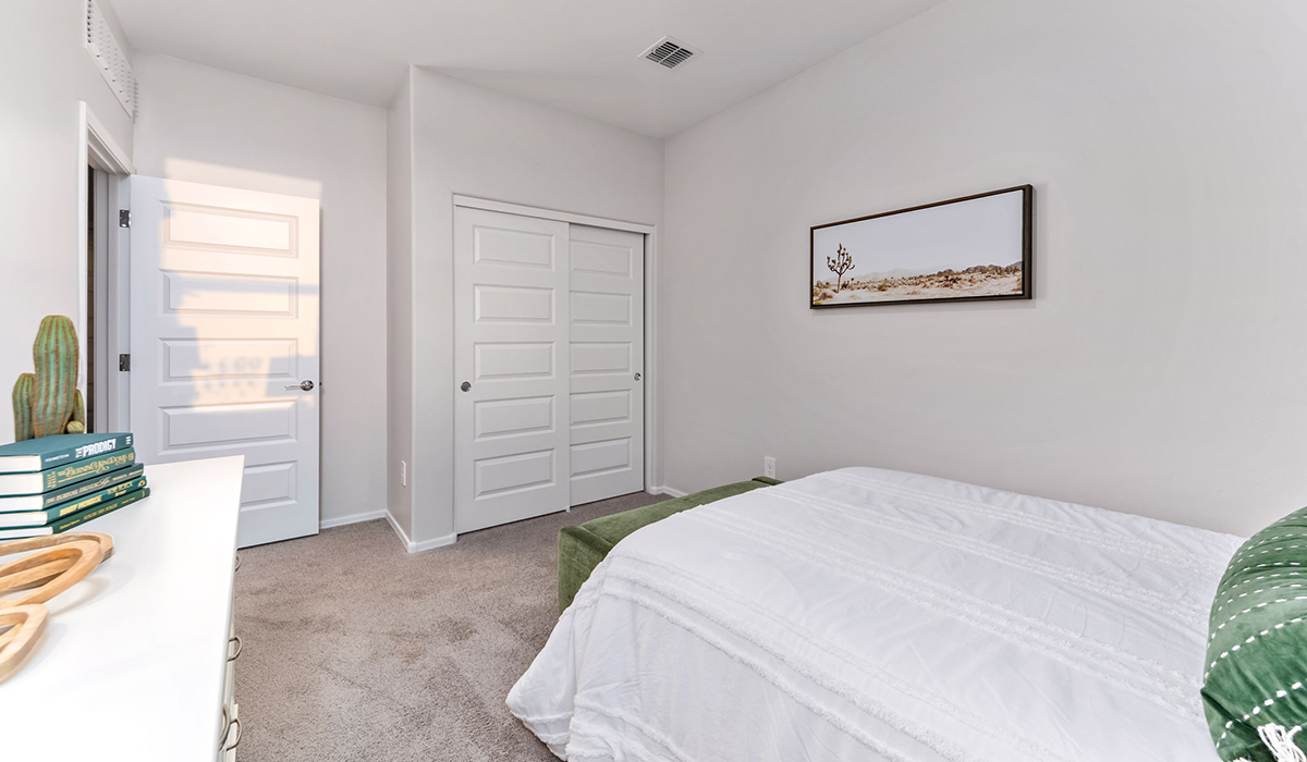 Welcome to The Caroline, the newest floor plan within Coronet at Gladden Farms Community in Marana, Arizona. This single-story new home is 1,536 square feet and is thoughtfully planned out throughout the living spaces. The Caroline offers three bedrooms and two bathrooms, making it ideal for families who value both space and convenience.  As you enter through the inviting covered porch, you’re greeted by a bright and airy entryway that flows into the heart of the home. The expansive great room, dining area, and kitchen are thoughtfully connected, creating an ideal space for entertaining or enjoying time with family. The kitchen features a large island, quartz countertops, Shaker-style cabinetry, spacious pantry, and modern stainless-steel appliances ensure your kitchen is both functional and stylish.  The Caroline’s layout includes a generously sized primary bedroom, carefully positioned for privacy at the rear of the home. This room features a large walk-in closet and an en-suite bathroom. The additional two bedrooms are well-sized and located in separate areas of the home with easy access to the main full bathroom.  The covered patio, accessible from the great room, offers a perfect spot for outdoor living, where you can enjoy Arizona’s beautiful weather throughout the year. Whether you’re hosting a barbecue or simply relaxing, this outdoor space enhances the home’s appeal.  The Caroline is designed with energy efficiency in mind. This DOE Zero Energy Ready Home offers a sustainable lifestyle with advanced features like tankless water heaters, energy-efficient LED lighting, and high-performance insulation, ensuring lower utility costs and a reduced environmental footprint.  Living at Coronet at Gladden Farms means enjoying a community that values both comfort and outdoor adventure. With access to 830 acres of green space, parks, playgrounds, and exclusive amenities like a sparkling pool, fitness center, and clubhouse, this community is perfect for families and active lifestyles.  *Images shown are for reference only. They depict the Caroline sales model home and may not represent the actual home.