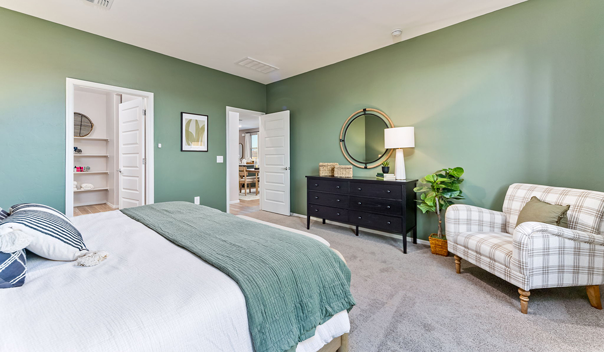 Welcome to The Caroline, the newest floor plan within Coronet at Gladden Farms Community in Marana, Arizona. This single-story new home is 1,536 square feet and is thoughtfully planned out throughout the living spaces. The Caroline offers three bedrooms and two bathrooms, making it ideal for families who value both space and convenience.  As you enter through the inviting covered porch, you’re greeted by a bright and airy entryway that flows into the heart of the home. The expansive great room, dining area, and kitchen are thoughtfully connected, creating an ideal space for entertaining or enjoying time with family. The kitchen features a large island, quartz countertops, Shaker-style cabinetry, spacious pantry, and modern stainless-steel appliances ensure your kitchen is both functional and stylish.  The Caroline’s layout includes a generously sized primary bedroom, carefully positioned for privacy at the rear of the home. This room features a large walk-in closet and an en-suite bathroom. The additional two bedrooms are well-sized and located in separate areas of the home with easy access to the main full bathroom.  The covered patio, accessible from the great room, offers a perfect spot for outdoor living, where you can enjoy Arizona’s beautiful weather throughout the year. Whether you’re hosting a barbecue or simply relaxing, this outdoor space enhances the home’s appeal.  The Caroline is designed with energy efficiency in mind. This DOE Zero Energy Ready Home offers a sustainable lifestyle with advanced features like tankless water heaters, energy-efficient LED lighting, and high-performance insulation, ensuring lower utility costs and a reduced environmental footprint.  Living at Coronet at Gladden Farms means enjoying a community that values both comfort and outdoor adventure. With access to 830 acres of green space, parks, playgrounds, and exclusive amenities like a sparkling pool, fitness center, and clubhouse, this community is perfect for families and active lifestyles.