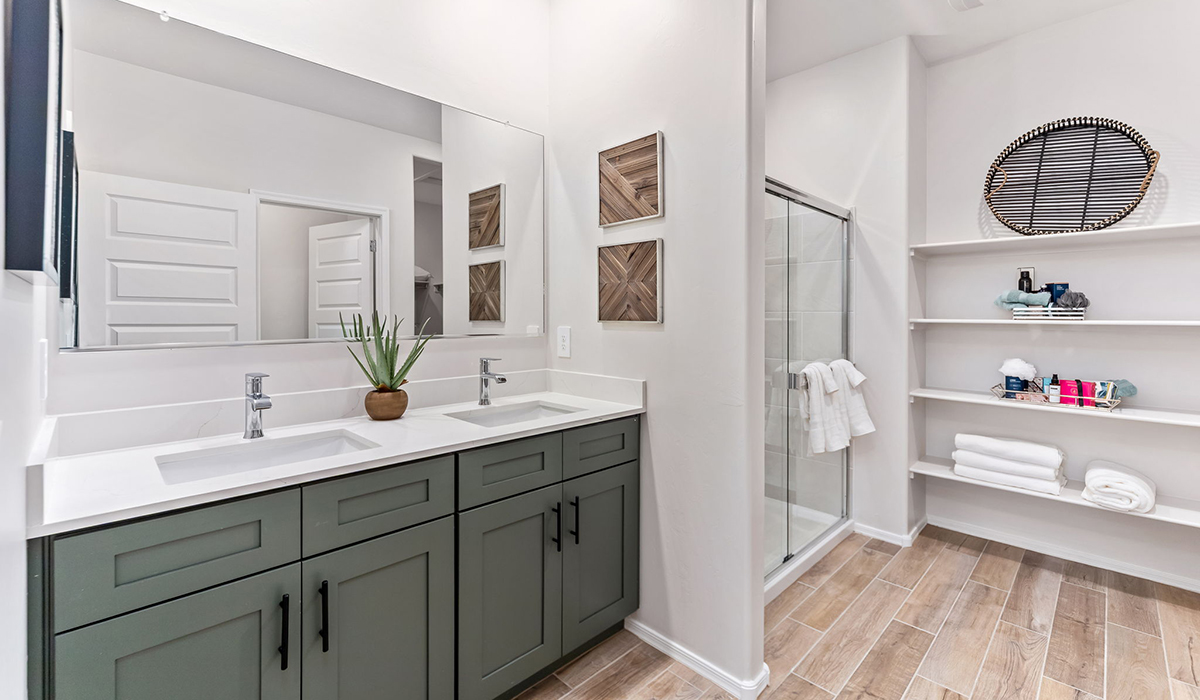 Welcome to The Caroline, the newest floor plan within Coronet at Gladden Farms Community in Marana, Arizona. This single-story new home is 1,536 square feet and is thoughtfully planned out throughout the living spaces. The Caroline offers three bedrooms and two bathrooms, making it ideal for families who value both space and convenience.  As you enter through the inviting covered porch, you’re greeted by a bright and airy entryway that flows into the heart of the home. The expansive great room, dining area, and kitchen are thoughtfully connected, creating an ideal space for entertaining or enjoying time with family. The kitchen features a large island, quartz countertops, Shaker-style cabinetry, spacious pantry, and modern stainless-steel appliances ensure your kitchen is both functional and stylish.  The Caroline’s layout includes a generously sized primary bedroom, carefully positioned for privacy at the rear of the home. This room features a large walk-in closet and an en-suite bathroom. The additional two bedrooms are well-sized and located in separate areas of the home with easy access to the main full bathroom.  The covered patio, accessible from the great room, offers a perfect spot for outdoor living, where you can enjoy Arizona’s beautiful weather throughout the year. Whether you’re hosting a barbecue or simply relaxing, this outdoor space enhances the home’s appeal.  The Caroline is designed with energy efficiency in mind. This DOE Zero Energy Ready Home offers a sustainable lifestyle with advanced features like tankless water heaters, energy-efficient LED lighting, and high-performance insulation, ensuring lower utility costs and a reduced environmental footprint.  Living at Coronet at Gladden Farms means enjoying a community that values both comfort and outdoor adventure. With access to 830 acres of green space, parks, playgrounds, and exclusive amenities like a sparkling pool, fitness center, and clubhouse, this community is perfect for families and active lifestyles.