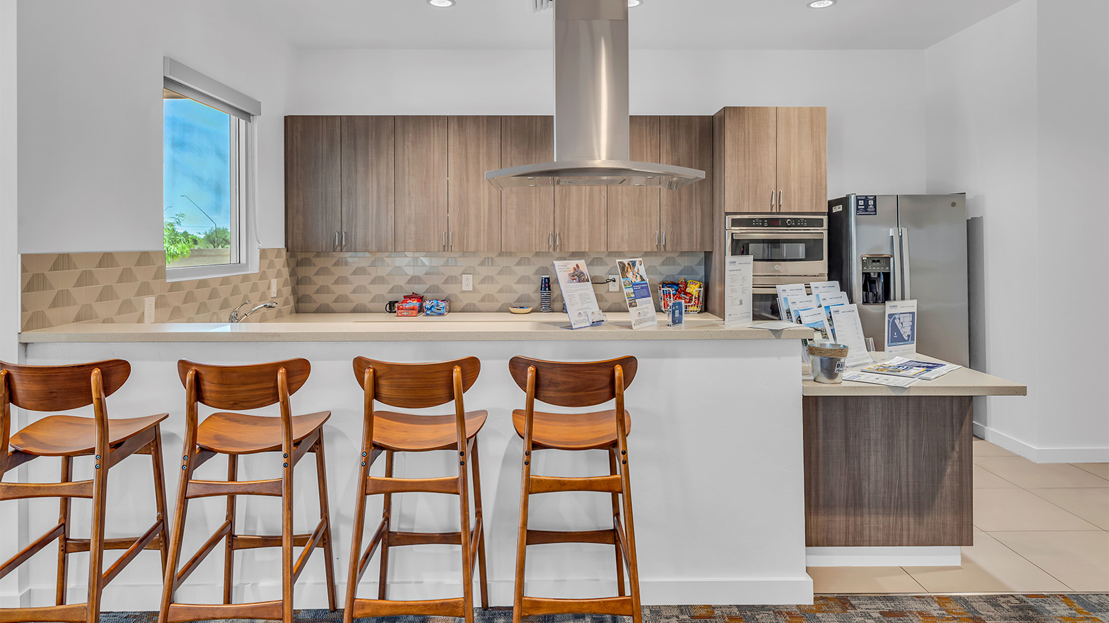 Welcome to The Caroline, the newest floor plan within Coronet at Gladden Farms Community in Marana, Arizona. This single-story new home is 1,536 square feet and is thoughtfully planned out throughout the living spaces. The Caroline offers three bedrooms and two bathrooms, making it ideal for families who value both space and convenience.  As you enter through the inviting covered porch, you’re greeted by a bright and airy entryway that flows into the heart of the home. The expansive great room, dining area, and kitchen are thoughtfully connected, creating an ideal space for entertaining or enjoying time with family. The kitchen features a large island, quartz countertops, Shaker-style cabinetry, spacious pantry, and modern stainless-steel appliances ensure your kitchen is both functional and stylish.  The Caroline’s layout includes a generously sized primary bedroom, carefully positioned for privacy at the rear of the home. This room features a large walk-in closet and an en-suite bathroom. The additional two bedrooms are well-sized and located in separate areas of the home with easy access to the main full bathroom.  The covered patio, accessible from the great room, offers a perfect spot for outdoor living, where you can enjoy Arizona’s beautiful weather throughout the year. Whether you’re hosting a barbecue or simply relaxing, this outdoor space enhances the home’s appeal.  The Caroline is designed with energy efficiency in mind. This DOE Zero Energy Ready Home offers a sustainable lifestyle with advanced features like tankless water heaters, energy-efficient LED lighting, and high-performance insulation, ensuring lower utility costs and a reduced environmental footprint.  Living at Coronet at Gladden Farms means enjoying a community that values both comfort and outdoor adventure. With access to 830 acres of green space, parks, playgrounds, and exclusive amenities like a sparkling pool, fitness center, and clubhouse, this community is perfect for families and active lifestyles.