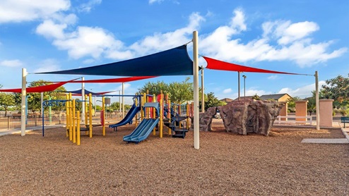Discover new homes within the only gated community in Gladden Farms. Coronet at Gladden Farms, a premier D.R. Horton community where modern living meets the scenic charm of Marana, Arizona. Coronet offers residents the perfect blend of small-town warmth and modern amenities. Surrounded by 830 acres of green space, 28 parks, and 19 playgrounds, this gated community is designed for families who value both comfort and outdoor adventure. Residents of Coronet at Gladden Farms enjoy exclusive amenities such as a sparkling community pool, jacuzzi, fitness center, and a clubhouse complete with a BBQ area and patio. The community also offers walking trails, a dog park, and playgrounds, making it the ideal environment for families and active lifestyles. Each home is thoughtfully designed with high-end finishes, including quartz countertops, wood-look luxury vinyl plank flooring, tile roofs, Spanish Lace stucco exteriors and beautifully landscaped front yards with auto drip irrigation. Additionally, all homes feature covered front porches and back patios, perfect for enjoying the stunning Arizona sunsets and monsoons. Coronet at Gladden Farms is built with a commitment to energy efficiency and sustainability. Each home meets the DOE Zero Energy Ready Home standards, meaning they are constructed to be so energy-efficient that a renewable energy system could offset most or all of the home's annual energy use. These homes include advanced features such as tankless water heaters, energy-efficient LED lighting, and high-performance insulation, ensuring lower utility costs and a reduced environmental footprint. The Home is Connected Smart Home package, which includes a smart thermostat, video doorbell, keyless entry, a Wi-Fi-enabled garage door opener, and much more, provides modern convenience and enhanced security. Living in Coronet at Gladden Farms means being part of a thriving community with easy access to shopping, dining, and recreation. The greater Gladden Farms area is equipped with amenities like a splashpad, soccer fields, and the Paws & Claws Dog Park. Families will appreciate being part of the Marana Unified School District, with Gladden Farms Elementary nearby and a new K-8 school opening in 2025. Beyond the community, residents can explore the natural beauty of the area with proximity to Picacho Peak State Park, Tortolita Mountain Park, and Saguaro National Park, offering endless opportunities for hiking, cycling, and wildlife viewing. Experience the perfect blend of comfort, convenience, and community at Coronet at Gladden Farms—where new homes, energy efficiency, and a vibrant lifestyle await.