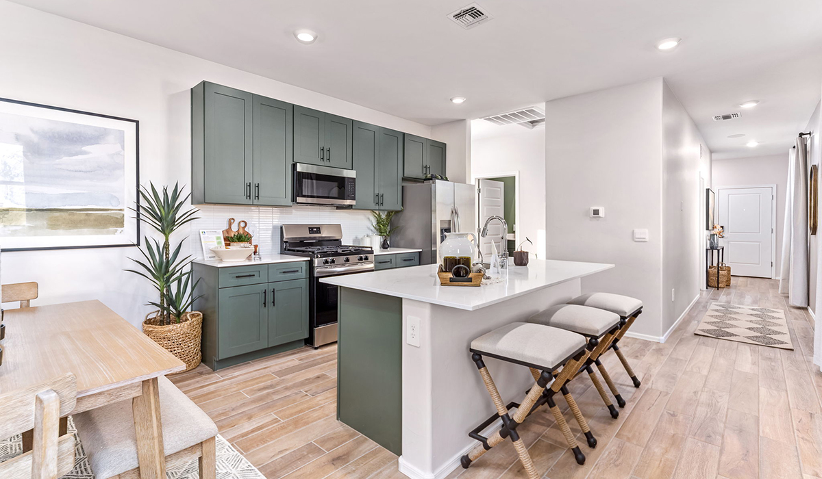 Welcome to The Caroline, the newest floor plan within Coronet at Gladden Farms Community in Marana, Arizona. This single-story new home is 1,536 square feet and is thoughtfully planned out throughout the living spaces. The Caroline offers three bedrooms and two bathrooms, making it ideal for families who value both space and convenience.  As you enter through the inviting covered porch, you’re greeted by a bright and airy entryway that flows into the heart of the home. The expansive great room, dining area, and kitchen are thoughtfully connected, creating an ideal space for entertaining or enjoying time with family.  The Caroline’s layout includes a generously sized primary bedroom, carefully positioned for privacy at the rear of the home. This spacious room features a large walk-in closet and an en-suite bathroom. The additional two bedrooms are well-sized and located in separate areas of the home with easy access to the main full bathroom.  The Caroline is designed with energy efficiency in mind and features a tankless water heater, energy-efficient LED lighting, and high-performance insulation, helping to lower utility costs.  Living at Coronet at Gladden Farms means enjoying a community that values both comfort and outdoor adventure. With access to 830 acres of green space, parks, playgrounds, and exclusive amenities like a sparkling pool, fitness center, and clubhouse, this community is perfect for families and active lifestyles.  *Images shown are for reference only. They depict The Caroline model home and may not represent the actual home.