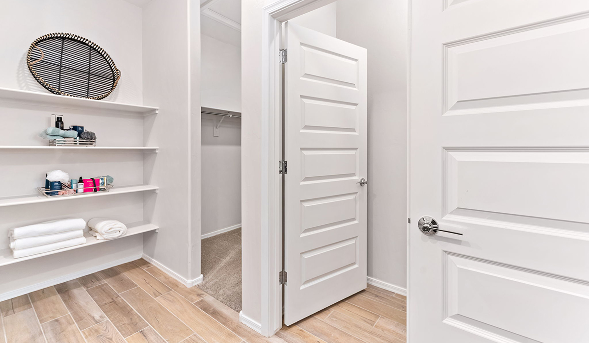 Welcome to The Caroline, the newest floor plan within Coronet at Gladden Farms Community in Marana, Arizona. This single-story new home is 1,536 square feet and is thoughtfully planned out throughout the living spaces. The Caroline offers three bedrooms and two bathrooms, making it ideal for families who value both space and convenience.  As you enter through the inviting covered porch, you’re greeted by a bright and airy entryway that flows into the heart of the home. The expansive great room, dining area, and kitchen are thoughtfully connected, creating an ideal space for entertaining or enjoying time with family. The kitchen features a large island, quartz countertops, Shaker-style cabinetry, spacious pantry, and modern stainless-steel appliances ensure your kitchen is both functional and stylish.  The Caroline’s layout includes a generously sized primary bedroom, carefully positioned for privacy at the rear of the home. This room features a large walk-in closet and an en-suite bathroom. The additional two bedrooms are well-sized and located in separate areas of the home with easy access to the main full bathroom.  The covered patio, accessible from the great room, offers a perfect spot for outdoor living, where you can enjoy Arizona’s beautiful weather throughout the year. Whether you’re hosting a barbecue or simply relaxing, this outdoor space enhances the home’s appeal.  The Caroline is designed with energy efficiency in mind. This DOE Zero Energy Ready Home offers a sustainable lifestyle with advanced features like tankless water heaters, energy-efficient LED lighting, and high-performance insulation, ensuring lower utility costs and a reduced environmental footprint.  Living at Coronet at Gladden Farms means enjoying a community that values both comfort and outdoor adventure. With access to 830 acres of green space, parks, playgrounds, and exclusive amenities like a sparkling pool, fitness center, and clubhouse, this community is perfect for families and active lifestyles.