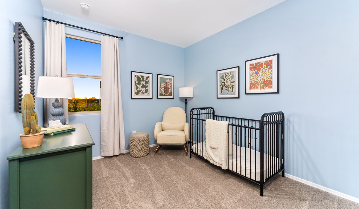 Welcome to The Caroline, the newest floor plan within Coronet at Gladden Farms Community in Marana, Arizona. This single-story new home is 1,536 square feet and is thoughtfully planned out throughout the living spaces. The Caroline offers three bedrooms and two bathrooms, making it ideal for families who value both space and convenience.  As you enter through the inviting covered porch, you’re greeted by a bright and airy entryway that flows into the heart of the home. The expansive great room, dining area, and kitchen are thoughtfully connected, creating an ideal space for entertaining or enjoying time with family. The kitchen features a large island, quartz countertops, Shaker-style cabinetry, spacious pantry, and modern stainless-steel appliances ensure your kitchen is both functional and stylish.  The Caroline’s layout includes a generously sized primary bedroom, carefully positioned for privacy at the rear of the home. This room features a large walk-in closet and an en-suite bathroom. The additional two bedrooms are well-sized and located in separate areas of the home with easy access to the main full bathroom.  The covered patio, accessible from the great room, offers a perfect spot for outdoor living, where you can enjoy Arizona’s beautiful weather throughout the year. Whether you’re hosting a barbecue or simply relaxing, this outdoor space enhances the home’s appeal.  The Caroline is designed with energy efficiency in mind. This DOE Zero Energy Ready Home offers a sustainable lifestyle with advanced features like tankless water heaters, energy-efficient LED lighting, and high-performance insulation, ensuring lower utility costs and a reduced environmental footprint.  Living at Coronet at Gladden Farms means enjoying a community that values both comfort and outdoor adventure. With access to 830 acres of green space, parks, playgrounds, and exclusive amenities like a sparkling pool, fitness center, and clubhouse, this community is perfect for families and active lifestyles.