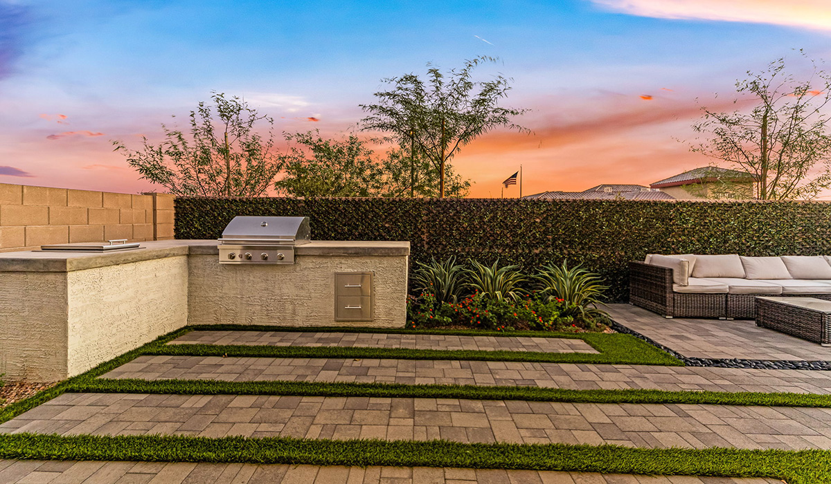 Welcome to The Caroline, the newest floor plan within Coronet at Gladden Farms Community in Marana, Arizona. This single-story new home is 1,536 square feet and is thoughtfully planned out throughout the living spaces. The Caroline offers three bedrooms and two bathrooms, making it ideal for families who value both space and convenience.  As you enter through the inviting covered porch, you’re greeted by a bright and airy entryway that flows into the heart of the home. The expansive great room, dining area, and kitchen are thoughtfully connected, creating an ideal space for entertaining or enjoying time with family. The kitchen features a large island, quartz countertops, Shaker-style cabinetry, spacious pantry, and modern stainless-steel appliances ensure your kitchen is both functional and stylish.  The Caroline’s layout includes a generously sized primary bedroom, carefully positioned for privacy at the rear of the home. This room features a large walk-in closet and an en-suite bathroom. The additional two bedrooms are well-sized and located in separate areas of the home with easy access to the main full bathroom.  The covered patio, accessible from the great room, offers a perfect spot for outdoor living, where you can enjoy Arizona’s beautiful weather throughout the year. Whether you’re hosting a barbecue or simply relaxing, this outdoor space enhances the home’s appeal.  The Caroline is designed with energy efficiency in mind. This DOE Zero Energy Ready Home offers a sustainable lifestyle with advanced features like tankless water heaters, energy-efficient LED lighting, and high-performance insulation, ensuring lower utility costs and a reduced environmental footprint.  Living at Coronet at Gladden Farms means enjoying a community that values both comfort and outdoor adventure. With access to 830 acres of green space, parks, playgrounds, and exclusive amenities like a sparkling pool, fitness center, and clubhouse, this community is perfect for families and active lifestyles.