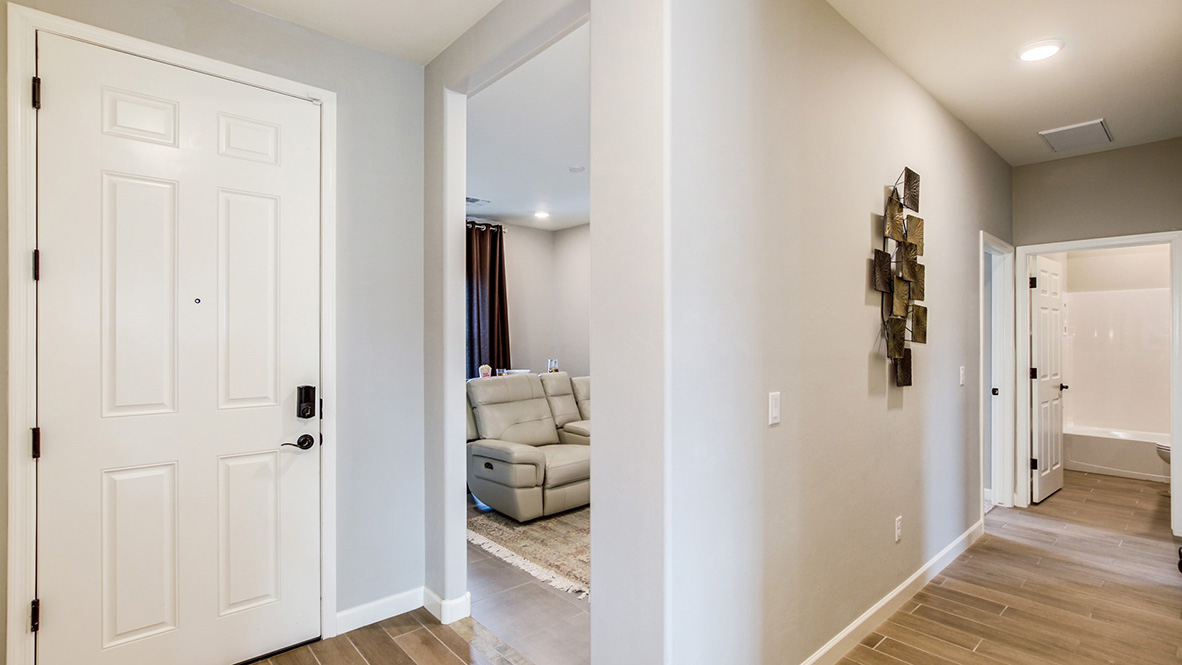 Welcome to The Citrine, a spacious single-story new home located in the Sycamore Vista. With 2,577 square feet of well-planned living space, this home offers four bedrooms, three bathrooms, and a dedicated study, making it ideal for families who value both space and convenience.  As you enter through the inviting covered porch, you’re greeted by a bright and airy entryway that flows into the heart of the home. The expansive great room, dining area, and kitchen are thoughtfully connected, creating an ideal space for entertaining or enjoying time with family. The kitchen features a large island, quartz countertops, and Shaker-style cabinetry. A spacious pantry and modern stainless-steel appliances ensure your kitchen is both functional and stylish.  The Citrine’s layout includes a generously sized primary bedroom, carefully positioned for privacy at the rear of the home. This room features a large walk-in closet and an en-suite bathroom with luxurious super shower. The additional three bedrooms are well-sized and located in separate areas of the home, ensuring privacy and easy access to two more full bathrooms.  One of the highlights of The Citrine is its versatile study, which can be used as a home office, media room, or extra bedroom for guests. The large laundry room, conveniently situated near the bedrooms, adds to the home’s practicality.  The covered patio, accessible from the great room, offers a perfect spot for outdoor living, where you can enjoy Arizona’s beautiful weather throughout the year. Whether you’re hosting a barbecue or simply relaxing, this outdoor space enhances the home’s appeal.  Designed with energy efficiency and modern living in mind, The Citrine includes smart home technology ensuring comfort and sustainability. Large windows throughout the home allow natural light to brighten every corner.  The Citrine combines style, comfort, and practicality, making it a perfect place to call home in one of Vails’s most sought-after communities.