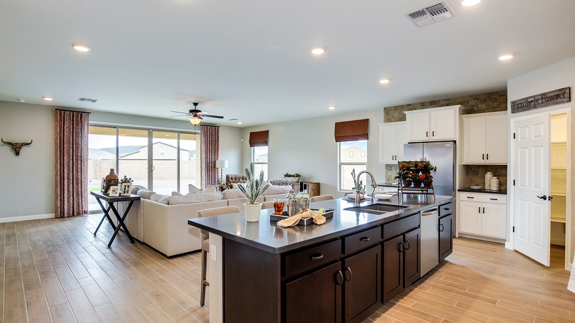 Welcome to The Citrine, a spacious single-story new home located in the Sycamore Vista. With 2,577 square feet of well-planned living space, this home offers four bedrooms, three bathrooms, and a dedicated study, making it ideal for families who value both space and convenience.  As you enter through the inviting covered porch, you’re greeted by a bright and airy entryway that flows into the heart of the home. The expansive great room, dining area, and kitchen are thoughtfully connected, creating an ideal space for entertaining or enjoying time with family. The kitchen features a large island, quartz countertops, and Shaker-style cabinetry. A spacious pantry and modern stainless-steel appliances ensure your kitchen is both functional and stylish.  The Citrine’s layout includes a generously sized primary bedroom, carefully positioned for privacy at the rear of the home. This room features a large walk-in closet and an en-suite bathroom with luxurious super shower. The additional three bedrooms are well-sized and located in separate areas of the home, ensuring privacy and easy access to two more full bathrooms.  One of the highlights of The Citrine is its versatile study, which can be used as a home office, media room, or extra bedroom for guests. The large laundry room, conveniently situated near the bedrooms, adds to the home’s practicality.  The covered patio, accessible from the great room, offers a perfect spot for outdoor living, where you can enjoy Arizona’s beautiful weather throughout the year. Whether you’re hosting a barbecue or simply relaxing, this outdoor space enhances the home’s appeal.  Designed with energy efficiency and modern living in mind, The Citrine includes smart home technology ensuring comfort and sustainability. Large windows throughout the home allow natural light to brighten every corner.  The Citrine combines style, comfort, and practicality, making it a perfect place to call home in one of Vails’s most sought-after communities.