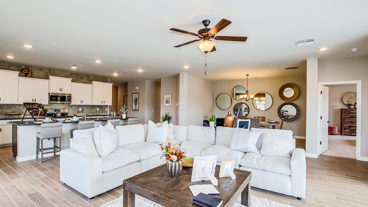 Welcome to The Citrine, a spacious single-story new home located in the Sycamore Vista. With 2,577 square feet of well-planned living space, this home offers four bedrooms, three bathrooms, and a dedicated study, making it ideal for families who value both space and convenience.  As you enter through the inviting covered porch, you’re greeted by a bright and airy entryway that flows into the heart of the home. The expansive great room, dining area, and kitchen are thoughtfully connected, creating an ideal space for entertaining or enjoying time with family. The kitchen features a large island, quartz countertops, and Shaker-style cabinetry. A spacious pantry and modern stainless-steel appliances ensure your kitchen is both functional and stylish.  The Citrine’s layout includes a generously sized primary bedroom, carefully positioned for privacy at the rear of the home. This room features a large walk-in closet and an en-suite bathroom with luxurious super shower. The additional three bedrooms are well-sized and located in separate areas of the home, ensuring privacy and easy access to two more full bathrooms.  One of the highlights of The Citrine is its versatile study, which can be used as a home office, media room, or extra bedroom for guests. The large laundry room, conveniently situated near the bedrooms, adds to the home’s practicality.  The covered patio, accessible from the great room, offers a perfect spot for outdoor living, where you can enjoy Arizona’s beautiful weather throughout the year. Whether you’re hosting a barbecue or simply relaxing, this outdoor space enhances the home’s appeal.  Designed with energy efficiency and modern living in mind, The Citrine includes smart home technology ensuring comfort and sustainability. Large windows throughout the home allow natural light to brighten every corner.  The Citrine combines style, comfort, and practicality, making it a perfect place to call home in one of Vails’s most sought-after communities.