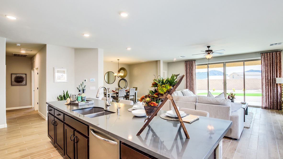 Welcome to The Citrine, a spacious single-story new home located in the Sycamore Vista. With 2,577 square feet of well-planned living space, this home offers four bedrooms, three bathrooms, and a dedicated study, making it ideal for families who value both space and convenience.  As you enter through the inviting covered porch, you’re greeted by a bright and airy entryway that flows into the heart of the home. The expansive great room, dining area, and kitchen are thoughtfully connected, creating an ideal space for entertaining or enjoying time with family. The kitchen features a large island, quartz countertops, and Shaker-style cabinetry. A spacious pantry and modern stainless-steel appliances ensure your kitchen is both functional and stylish.  The Citrine’s layout includes a generously sized primary bedroom, carefully positioned for privacy at the rear of the home. This room features a large walk-in closet and an en-suite bathroom with luxurious super shower. The additional three bedrooms are well-sized and located in separate areas of the home, ensuring privacy and easy access to two more full bathrooms.  One of the highlights of The Citrine is its versatile study, which can be used as a home office, media room, or extra bedroom for guests. The large laundry room, conveniently situated near the bedrooms, adds to the home’s practicality.  The covered patio, accessible from the great room, offers a perfect spot for outdoor living, where you can enjoy Arizona’s beautiful weather throughout the year. Whether you’re hosting a barbecue or simply relaxing, this outdoor space enhances the home’s appeal.  Designed with energy efficiency and modern living in mind, The Citrine includes smart home technology ensuring comfort and sustainability. Large windows throughout the home allow natural light to brighten every corner.  The Citrine combines style, comfort, and practicality, making it a perfect place to call home in one of Vails’s most sought-after communities.