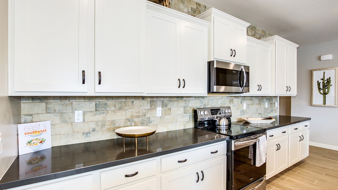 Welcome to The Citrine, a spacious single-story new home located in the Sycamore Vista. With 2,577 square feet of well-planned living space, this home offers four bedrooms, three bathrooms, and a dedicated study, making it ideal for families who value both space and convenience.  As you enter through the inviting covered porch, you’re greeted by a bright and airy entryway that flows into the heart of the home. The expansive great room, dining area, and kitchen are thoughtfully connected, creating an ideal space for entertaining or enjoying time with family. The kitchen features a large island, quartz countertops, and Shaker-style cabinetry. A spacious pantry and modern stainless-steel appliances ensure your kitchen is both functional and stylish.  The Citrine’s layout includes a generously sized primary bedroom, carefully positioned for privacy at the rear of the home. This room features a large walk-in closet and an en-suite bathroom with luxurious super shower. The additional three bedrooms are well-sized and located in separate areas of the home, ensuring privacy and easy access to two more full bathrooms.  One of the highlights of The Citrine is its versatile study, which can be used as a home office, media room, or extra bedroom for guests. The large laundry room, conveniently situated near the bedrooms, adds to the home’s practicality.  The covered patio, accessible from the great room, offers a perfect spot for outdoor living, where you can enjoy Arizona’s beautiful weather throughout the year. Whether you’re hosting a barbecue or simply relaxing, this outdoor space enhances the home’s appeal.  Designed with energy efficiency and modern living in mind, The Citrine includes smart home technology ensuring comfort and sustainability. Large windows throughout the home allow natural light to brighten every corner.  The Citrine combines style, comfort, and practicality, making it a perfect place to call home in one of Vails’s most sought-after communities.