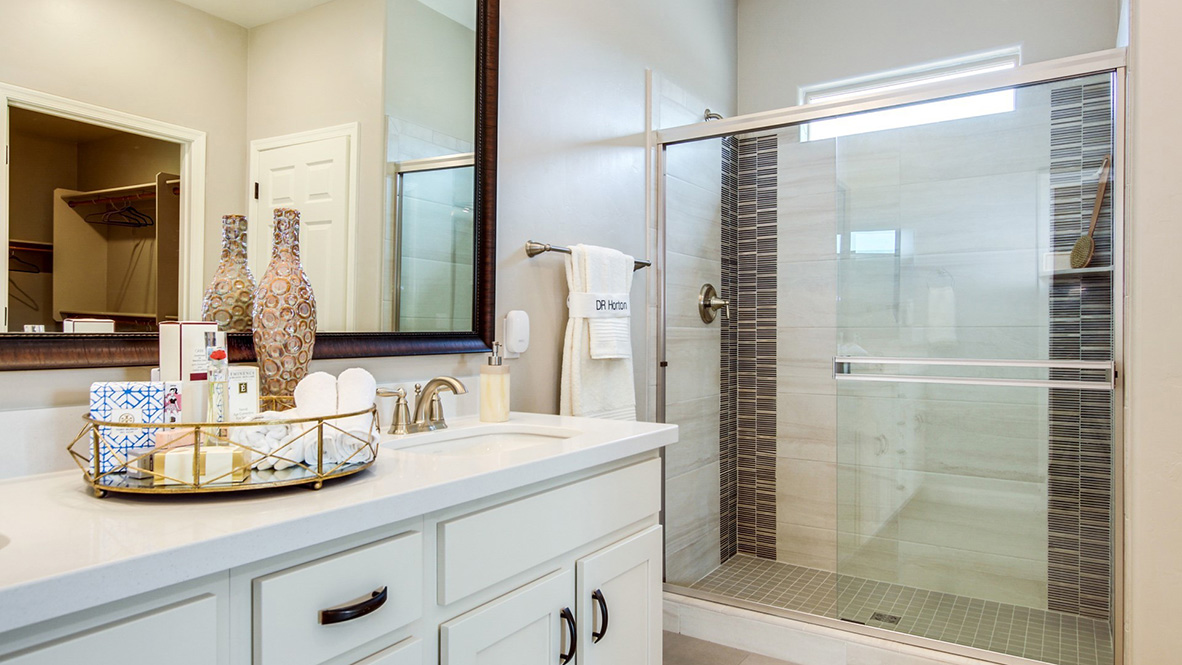 Welcome to The Citrine, a spacious single-story new home located in the Sycamore Vista. With 2,577 square feet of well-planned living space, this home offers four bedrooms, three bathrooms, and a dedicated study, making it ideal for families who value both space and convenience.  As you enter through the inviting covered porch, you’re greeted by a bright and airy entryway that flows into the heart of the home. The expansive great room, dining area, and kitchen are thoughtfully connected, creating an ideal space for entertaining or enjoying time with family. The kitchen features a large island, quartz countertops, and Shaker-style cabinetry. A spacious pantry and modern stainless-steel appliances ensure your kitchen is both functional and stylish.  The Citrine’s layout includes a generously sized primary bedroom, carefully positioned for privacy at the rear of the home. This room features a large walk-in closet and an en-suite bathroom with luxurious super shower. The additional three bedrooms are well-sized and located in separate areas of the home, ensuring privacy and easy access to two more full bathrooms.  One of the highlights of The Citrine is its versatile study, which can be used as a home office, media room, or extra bedroom for guests. The large laundry room, conveniently situated near the bedrooms, adds to the home’s practicality.  The covered patio, accessible from the great room, offers a perfect spot for outdoor living, where you can enjoy Arizona’s beautiful weather throughout the year. Whether you’re hosting a barbecue or simply relaxing, this outdoor space enhances the home’s appeal.  Designed with energy efficiency and modern living in mind, The Citrine includes smart home technology ensuring comfort and sustainability. Large windows throughout the home allow natural light to brighten every corner.  The Citrine combines style, comfort, and practicality, making it a perfect place to call home in one of Vails’s most sought-after communities.