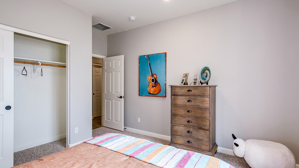 Welcome to The Citrine, a spacious single-story new home located in the Sycamore Vista. With 2,577 square feet of well-planned living space, this home offers four bedrooms, three bathrooms, and a dedicated study, making it ideal for families who value both space and convenience.  As you enter through the inviting covered porch, you’re greeted by a bright and airy entryway that flows into the heart of the home. The expansive great room, dining area, and kitchen are thoughtfully connected, creating an ideal space for entertaining or enjoying time with family. The kitchen features a large island, quartz countertops, and Shaker-style cabinetry. A spacious pantry and modern stainless-steel appliances ensure your kitchen is both functional and stylish.  The Citrine’s layout includes a generously sized primary bedroom, carefully positioned for privacy at the rear of the home. This room features a large walk-in closet and an en-suite bathroom with luxurious super shower. The additional three bedrooms are well-sized and located in separate areas of the home, ensuring privacy and easy access to two more full bathrooms.  One of the highlights of The Citrine is its versatile study, which can be used as a home office, media room, or extra bedroom for guests. The large laundry room, conveniently situated near the bedrooms, adds to the home’s practicality.  The covered patio, accessible from the great room, offers a perfect spot for outdoor living, where you can enjoy Arizona’s beautiful weather throughout the year. Whether you’re hosting a barbecue or simply relaxing, this outdoor space enhances the home’s appeal.  Designed with energy efficiency and modern living in mind, The Citrine includes smart home technology ensuring comfort and sustainability. Large windows throughout the home allow natural light to brighten every corner.  The Citrine combines style, comfort, and practicality, making it a perfect place to call home in one of Vails’s most sought-after communities.