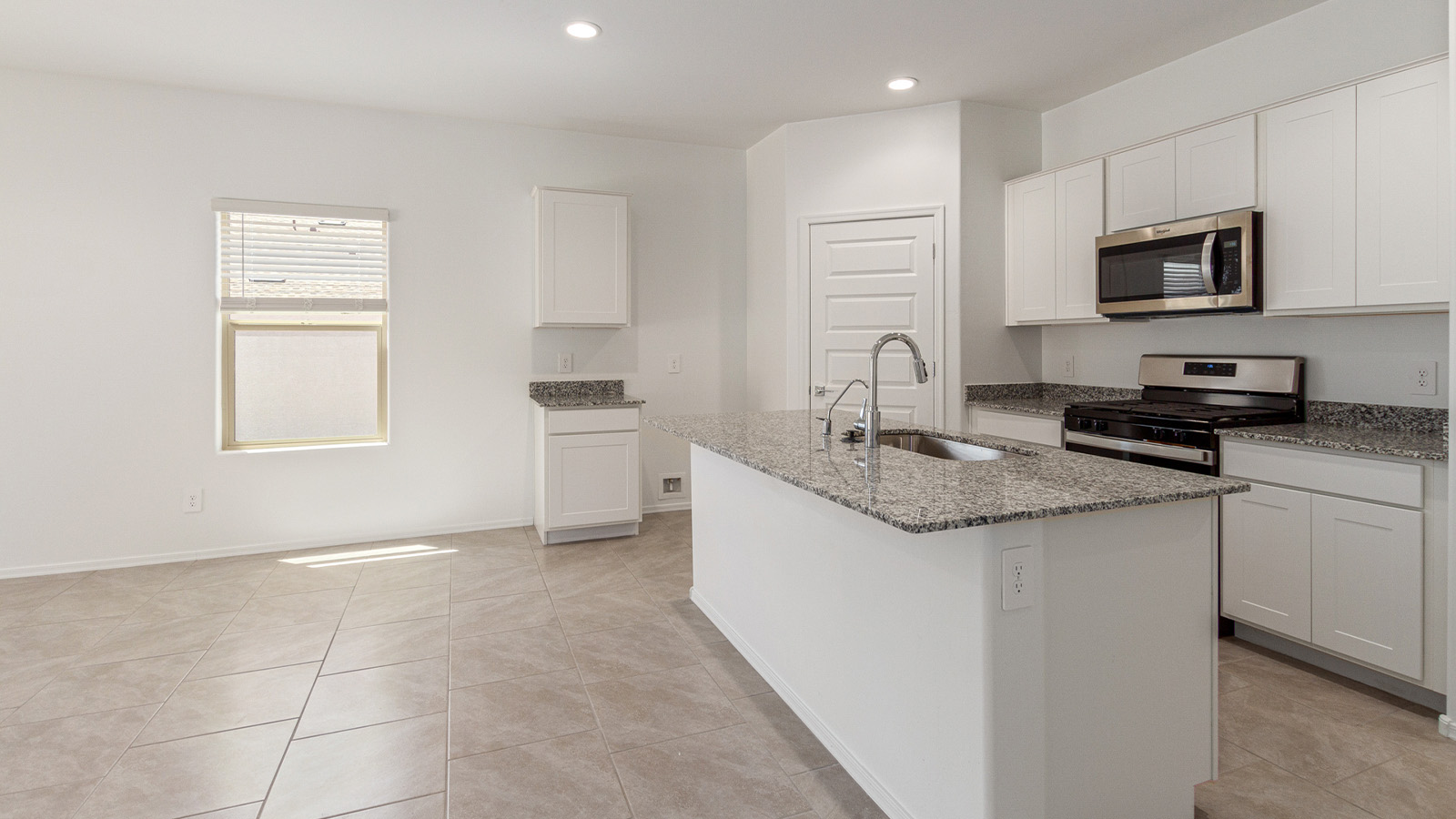 Step into The Elgin, a spacious single-story home located in the scenic Sycamore Vista community in Vail, AZ. This floor plan offers 1,635 square feet of well-planned living space, perfect for those who appreciate both comfort and functionality. With four bedrooms, two bathrooms, and a 3-car garage, The Elgin provides the ideal setting for modern living amidst the beauty of the Santa Rita Mountains.  As you enter through the inviting front porch, you’re welcomed by an open and airy floor plan that flows effortlessly from one room to the next. The heart of the home is the expansive great room, seamlessly connected to the dining area and kitchen, making it ideal for everyday living and entertaining. The kitchen is a chef’s delight, featuring a large island with a breakfast bar, granite countertops, and Shaker-style cabinetry, offering ample storage and workspace. The walk-in pantry and adjacent utility room add convenience and organization to your culinary adventures.  The primary suite is designed with relaxation in mind, offering a spacious bedroom with a walk-in closet and a private en-suite bathroom. This personal haven is positioned at the rear of the home for added privacy. The three additional bedrooms are located towards the front of the home, providing flexibility for guests, family, or a home office setup. A second full bathroom is conveniently situated near these bedrooms.  One of the standout features of The Elgin is the 3-car garage, providing plenty of room for vehicles, storage, or even a workshop. Whether you have multiple cars, recreational vehicles, or just need extra space, this garage has you covered.  Step outside to enjoy your covered patio, which is perfect for outdoor dining, lounging, or simply taking in the stunning Arizona sunsets. The large backyard provides endless possibilities for gardening, play, or creating your own outdoor oasis.  Living at Sycamore Vista means enjoying a community that balances modern amenities with natural beauty. Your home includes luxury finishes such as staggered wood-look ceramic tile flooring throughout most areas, granite countertops, and energy-efficient features like spray foam insulation and tankless water heaters. Additionally, each home in the community comes equipped with a Home is Connected® Smart Home package, offering conveniences like a smart thermostat, video doorbell, keyless entry, a wifi-enabled garage door opener and more.  Sycamore Vista’s prime location in the Vail School District makes it a great choice for families. With schools like Sycamore Elementary and Corona Foothills Middle School nearby, you’ll have peace of mind knowing your children are receiving a quality education. The community’s higher elevation offers cooler summer temperatures and spectacular night skies, making it a perfect spot for stargazing.  Experience the perfect blend of rural charm and modern convenience at Sycamore Vista, where The Elgin offers a space that’s more than just a house—it’s a home designed to grow with you and your family.  *Images shown are for reference only. They depict The Elgin spec home and may not represent the actual home.