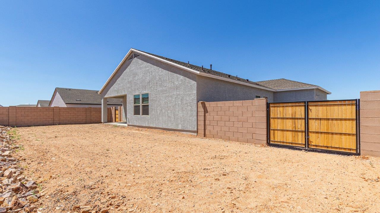 Step into The Elgin, a spacious single-story home located in the scenic Sycamore Vista community in Vail, AZ. This floor plan offers 1,635 square feet of well-planned living space, perfect for those who appreciate both comfort and functionality. With four bedrooms, two bathrooms, and a 3-car garage, The Elgin provides the ideal setting for modern living amidst the beauty of the Santa Rita Mountains.  As you enter through the inviting front porch, you’re welcomed by an open and airy floor plan that flows effortlessly from one room to the next. The heart of the home is the expansive great room, seamlessly connected to the dining area and kitchen, making it ideal for everyday living and entertaining. The kitchen is a chef’s delight, featuring a large island with a breakfast bar, granite countertops, and Shaker-style cabinetry, offering ample storage and workspace. The walk-in pantry and adjacent utility room add convenience and organization to your culinary adventures.  The primary suite is designed with relaxation in mind, offering a spacious bedroom with a walk-in closet and a private en-suite bathroom. This personal haven is positioned at the rear of the home for added privacy. The three additional bedrooms are located towards the front of the home, providing flexibility for guests, family, or a home office setup. A second full bathroom is conveniently situated near these bedrooms.  One of the standout features of The Elgin is the 3-car garage, providing plenty of room for vehicles, storage, or even a workshop. Whether you have multiple cars, recreational vehicles, or just need extra space, this garage has you covered.  Step outside to enjoy your covered patio, which is perfect for outdoor dining, lounging, or simply taking in the stunning Arizona sunsets. The large backyard provides endless possibilities for gardening, play, or creating your own outdoor oasis.  Living at Sycamore Vista means enjoying a community that balances modern amenities with natural beauty. Your home includes luxury finishes such as staggered wood-look ceramic tile flooring throughout most areas, granite countertops, and energy-efficient features like spray foam insulation and tankless water heaters. Additionally, each home in the community comes equipped with a Home is Connected® Smart Home package, offering conveniences like a smart thermostat, video doorbell, keyless entry, a wifi-enabled garage door opener and more.  Sycamore Vista’s prime location in the Vail School District makes it a great choice for families. With schools like Sycamore Elementary and Corona Foothills Middle School nearby, you’ll have peace of mind knowing your children are receiving a quality education. The community’s higher elevation offers cooler summer temperatures and spectacular night skies, making it a perfect spot for stargazing.  Experience the perfect blend of rural charm and modern convenience at Sycamore Vista, where The Elgin offers a space that’s more than just a house—it’s a home designed to grow with you and your family.  *Images shown are for reference only. They depict The Elgin spec home and may not represent the actual home.