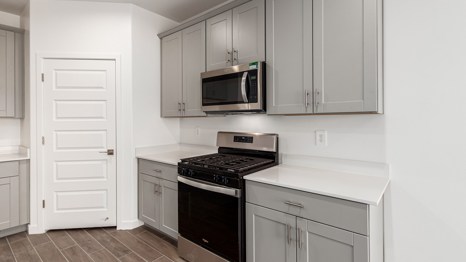 Snuggled within the serene surroundings of Sycamore Vista, The Baxter offers a blend of comfort and convenience, making it a perfect fit for modern living. Spanning 1,423 square feet, this thoughtfully crafted single-story home features three bedrooms, two bathrooms, and a three-car garage, all within the picturesque foothills of the Santa Rita Mountains.  As you step onto the welcoming front porch and enter through the foyer, you’re greeted by a spacious and open floor plan that flows effortlessly into the heart of the home. The great room is designed for both relaxation and socializing, seamlessly connecting to the dining area and kitchen. The kitchen is a culinary enthusiast's dream, featuring sleek granite countertops, a central island, and Shaker-style cabinetry, all designed to offer ample storage and a stylish backdrop for your cooking adventures. The adjacent pantry ensures that all your essentials are within easy reach, making meal prep both efficient and enjoyable.  The primary bedroom, located at the rear of the home for enhanced privacy, serves as a peaceful retreat. It includes a spacious walk-in closet and an en-suite bathroom equipped with dual vanities and a luxurious shower. The two additional bedrooms are thoughtfully positioned near the front of the home, sharing a full bathroom, making it ideal for families or guests.  Outdoor living is a key feature of The Baxter, with a covered patio that extends from the dining area, offering the perfect space to enjoy Tucson’s stunning sunsets or host a weekend barbecue. The three-car garage provides ample space for vehicles, storage, or even a small workshop, catering to various needs.  Living in Sycamore Vista means you’re part of a community that values both convenience and quality of life. Each home in this community comes with beautifully landscaped front yards, equipped with auto drip irrigation systems and soft water loops, enhancing the beauty and functionality of your outdoor space. Additionally, Sycamore Vista homes are energy-efficient, featuring DOE Zero Energy Ready standards, including spray foam insulation, tankless water heaters, and LED lighting throughout, ensuring lower energy costs and a reduced environmental footprint.  The community’s higher elevation not only offers cooler summer temperatures but also less light pollution, making it a perfect spot for stargazing. Sycamore Vista is ideally located near top-rated schools in the Vail School District, including Sycamore Elementary and Corona Foothills Middle School, making it an ideal choice for families.  Beyond the tranquility of home, outdoor enthusiasts will appreciate the proximity to local state and national parks, including Coronado National Forest and Colossal Cave Mountain Park, offering endless opportunities for hiking, biking, and exploring Arizona’s natural beauty. The community’s location also provides easy access to shopping, dining, and major employers like the Target Distribution Center and the Amazon Fulfillment Center, ensuring that everything you need is within reach.  Experience the best of Arizona living at Sycamore Vista, where The Baxter offers the perfect blend of modern amenities, quality craftsmanship, and the natural beauty of the Santa Rita Mountains, creating a place you’ll be proud to call home.