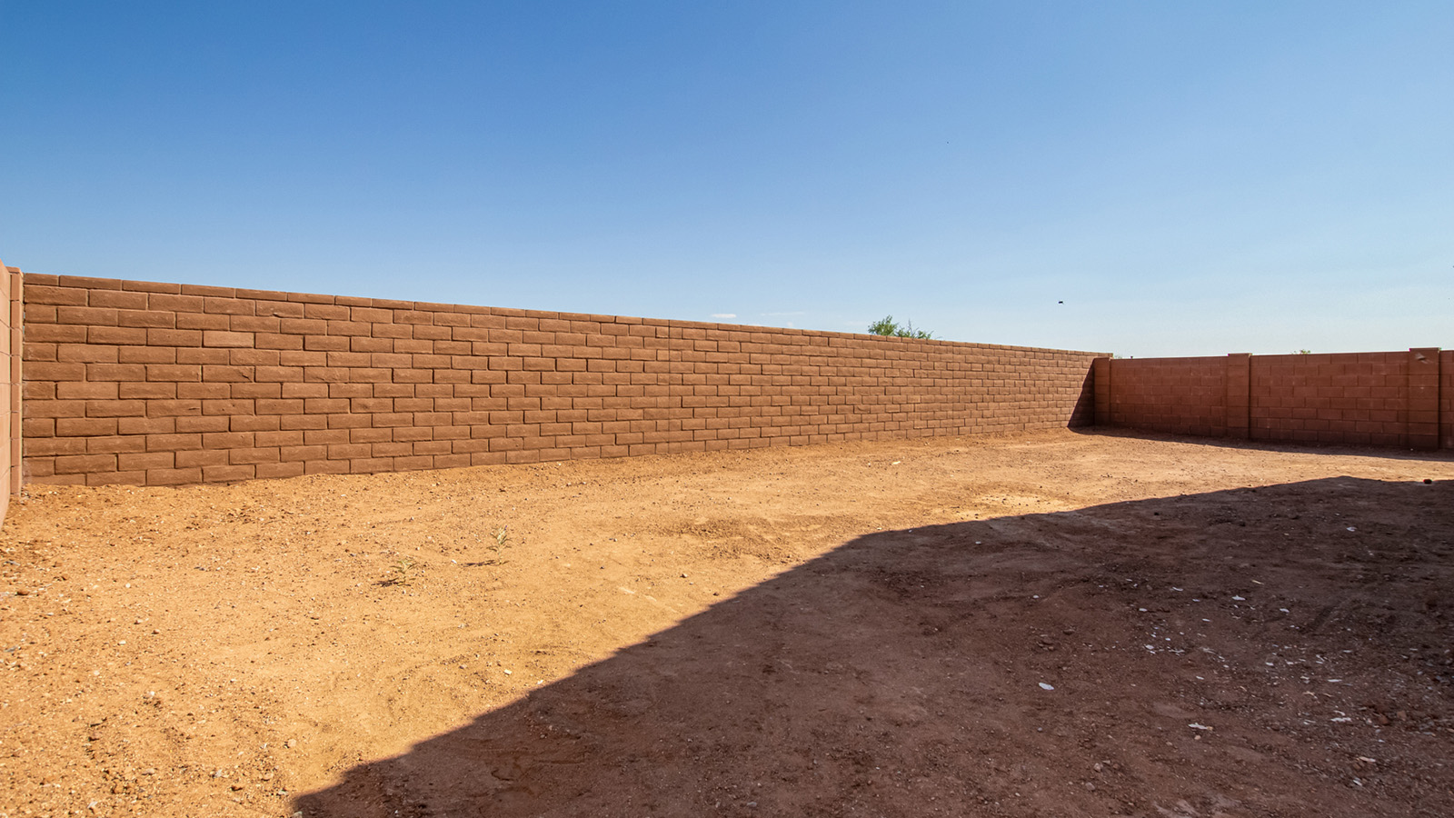 Snuggled within the serene surroundings of Sycamore Vista, The Baxter offers a blend of comfort and convenience, making it a perfect fit for modern living. Spanning 1,423 square feet, this thoughtfully crafted single-story home features three bedrooms, two bathrooms, and a three-car garage, all within the picturesque foothills of the Santa Rita Mountains.  As you step onto the welcoming front porch and enter through the foyer, you’re greeted by a spacious and open floor plan that flows effortlessly into the heart of the home. The great room is designed for both relaxation and socializing, seamlessly connecting to the dining area and kitchen. The kitchen is a culinary enthusiast's dream, featuring sleek granite countertops, a central island, and Shaker-style cabinetry, all designed to offer ample storage and a stylish backdrop for your cooking adventures. The adjacent pantry ensures that all your essentials are within easy reach, making meal prep both efficient and enjoyable.  The primary bedroom, located at the rear of the home for enhanced privacy, serves as a peaceful retreat. It includes a spacious walk-in closet and an en-suite bathroom equipped with dual vanities and a luxurious shower. The two additional bedrooms are thoughtfully positioned near the front of the home, sharing a full bathroom, making it ideal for families or guests.  Outdoor living is a key feature of The Baxter, with a covered patio that extends from the dining area, offering the perfect space to enjoy Tucson’s stunning sunsets or host a weekend barbecue. The three-car garage provides ample space for vehicles, storage, or even a small workshop, catering to various needs.  Living in Sycamore Vista means you’re part of a community that values both convenience and quality of life. Each home in this community comes with beautifully landscaped front yards, equipped with auto drip irrigation systems and soft water loops, enhancing the beauty and functionality of your outdoor space. Additionally, Sycamore Vista homes are energy-efficient, featuring DOE Zero Energy Ready standards, including spray foam insulation, tankless water heaters, and LED lighting throughout, ensuring lower energy costs and a reduced environmental footprint.  The community’s higher elevation not only offers cooler summer temperatures but also less light pollution, making it a perfect spot for stargazing. Sycamore Vista is ideally located near top-rated schools in the Vail School District, including Sycamore Elementary and Corona Foothills Middle School, making it an ideal choice for families.  Beyond the tranquility of home, outdoor enthusiasts will appreciate the proximity to local state and national parks, including Coronado National Forest and Colossal Cave Mountain Park, offering endless opportunities for hiking, biking, and exploring Arizona’s natural beauty. The community’s location also provides easy access to shopping, dining, and major employers like the Target Distribution Center and the Amazon Fulfillment Center, ensuring that everything you need is within reach.  Experience the best of Arizona living at Sycamore Vista, where The Baxter offers the perfect blend of modern amenities, quality craftsmanship, and the natural beauty of the Santa Rita Mountains, creating a place you’ll be proud to call home.