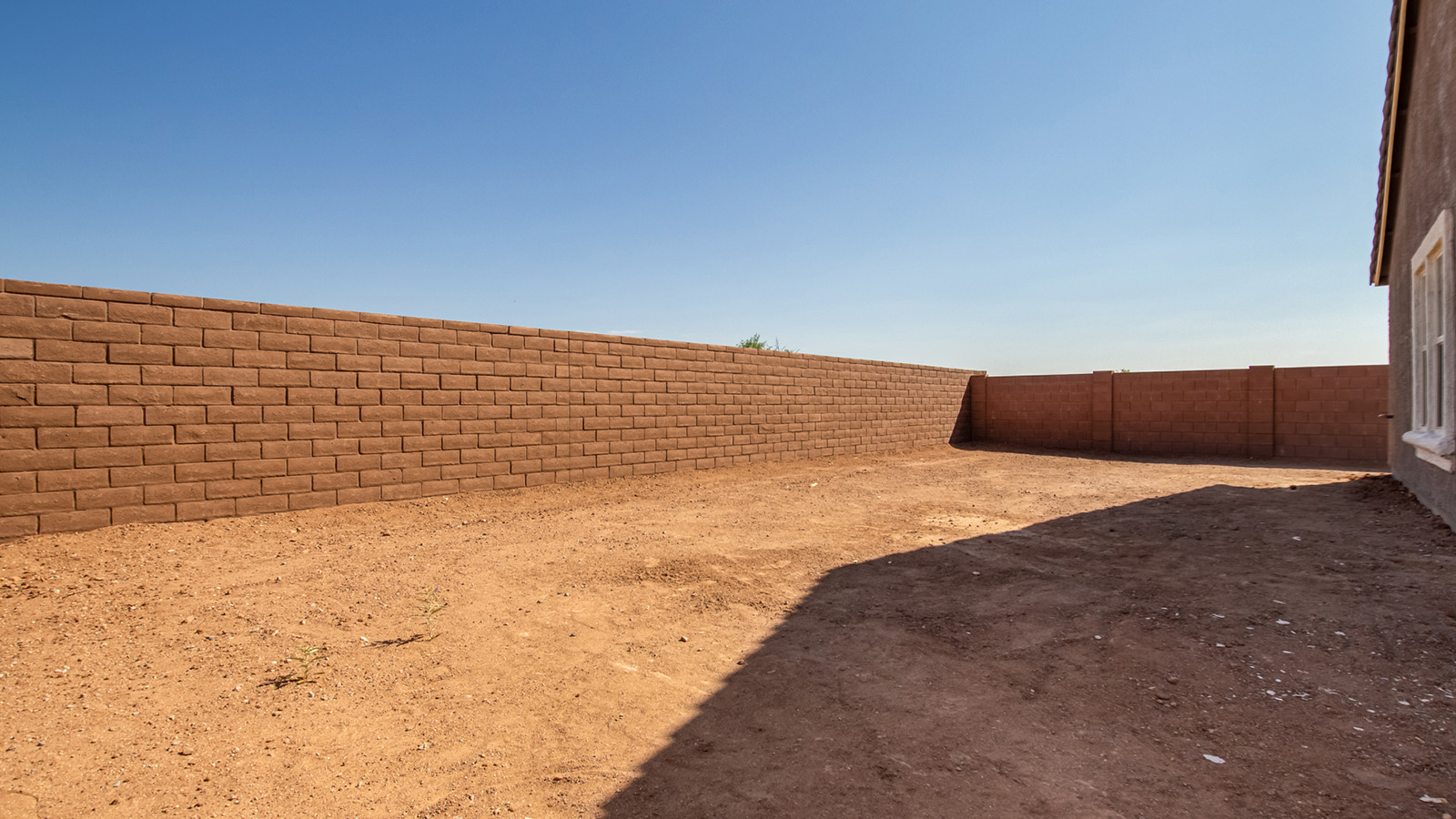 Snuggled within the serene surroundings of Sycamore Vista, The Baxter offers a blend of comfort and convenience, making it a perfect fit for modern living. Spanning 1,423 square feet, this thoughtfully crafted single-story home features three bedrooms, two bathrooms, and a three-car garage, all within the picturesque foothills of the Santa Rita Mountains.  As you step onto the welcoming front porch and enter through the foyer, you’re greeted by a spacious and open floor plan that flows effortlessly into the heart of the home. The great room is designed for both relaxation and socializing, seamlessly connecting to the dining area and kitchen. The kitchen is a culinary enthusiast's dream, featuring sleek granite countertops, a central island, and Shaker-style cabinetry, all designed to offer ample storage and a stylish backdrop for your cooking adventures. The adjacent pantry ensures that all your essentials are within easy reach, making meal prep both efficient and enjoyable.  The primary bedroom, located at the rear of the home for enhanced privacy, serves as a peaceful retreat. It includes a spacious walk-in closet and an en-suite bathroom equipped with dual vanities and a luxurious shower. The two additional bedrooms are thoughtfully positioned near the front of the home, sharing a full bathroom, making it ideal for families or guests.  Outdoor living is a key feature of The Baxter, with a covered patio that extends from the dining area, offering the perfect space to enjoy Tucson’s stunning sunsets or host a weekend barbecue. The three-car garage provides ample space for vehicles, storage, or even a small workshop, catering to various needs.  Living in Sycamore Vista means you’re part of a community that values both convenience and quality of life. Each home in this community comes with beautifully landscaped front yards, equipped with auto drip irrigation systems and soft water loops, enhancing the beauty and functionality of your outdoor space. Additionally, Sycamore Vista homes are energy-efficient, featuring DOE Zero Energy Ready standards, including spray foam insulation, tankless water heaters, and LED lighting throughout, ensuring lower energy costs and a reduced environmental footprint.  The community’s higher elevation not only offers cooler summer temperatures but also less light pollution, making it a perfect spot for stargazing. Sycamore Vista is ideally located near top-rated schools in the Vail School District, including Sycamore Elementary and Corona Foothills Middle School, making it an ideal choice for families.  Beyond the tranquility of home, outdoor enthusiasts will appreciate the proximity to local state and national parks, including Coronado National Forest and Colossal Cave Mountain Park, offering endless opportunities for hiking, biking, and exploring Arizona’s natural beauty. The community’s location also provides easy access to shopping, dining, and major employers like the Target Distribution Center and the Amazon Fulfillment Center, ensuring that everything you need is within reach.  Experience the best of Arizona living at Sycamore Vista, where The Baxter offers the perfect blend of modern amenities, quality craftsmanship, and the natural beauty of the Santa Rita Mountains, creating a place you’ll be proud to call home.