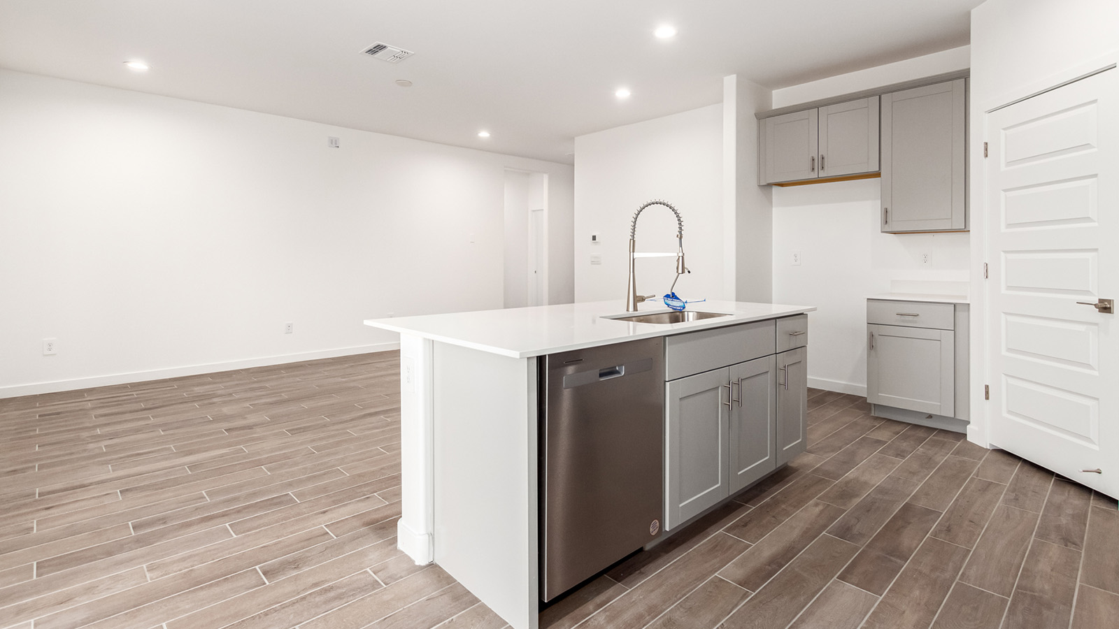 Snuggled within the serene surroundings of Sycamore Vista, The Baxter offers a blend of comfort and convenience, making it a perfect fit for modern living. Spanning 1,423 square feet, this thoughtfully crafted single-story home features three bedrooms, two bathrooms, and a two-car garage, all within the picturesque foothills of the Santa Rita Mountains.  As you step onto the welcoming front porch and enter through the foyer, you’re greeted by a spacious and open floor plan that flows effortlessly into the heart of the home. The great room is designed for both relaxation and socializing, seamlessly connecting to the dining area and kitchen. The kitchen is a culinary enthusiast's dream, featuring sleek quartz countertops, a central island, and Shaker-style cabinetry, all designed to offer ample storage and a stylish backdrop for your cooking adventures. The adjacent pantry ensures that all your essentials are within easy reach, making meal prep both efficient and enjoyable.  The primary bedroom, located at the rear of the home for enhanced privacy, serves as a peaceful retreat. It includes a spacious walk-in closet and an en-suite bathroom equipped with dual vanities and a luxurious shower. The two additional bedrooms are thoughtfully positioned near the front of the home, sharing a full bathroom, making it ideal for families or guests.  Outdoor living is a key feature of The Baxter, with a covered patio that extends from the dining area, offering the perfect space to enjoy Tucson’s stunning sunsets or host a weekend barbecue.  Living in Sycamore Vista means you’re part of a community that values both convenience and quality of life. Each home in this community comes with beautifully landscaped front yards, equipped with auto drip irrigation systems and soft water loops, enhancing the beauty and functionality of your outdoor space. Additionally, Sycamore Vista homes are energy-efficient, featuring DOE Zero Energy Ready standards, including spray foam insulation, tankless water heaters, and LED lighting throughout, ensuring lower energy costs and a reduced environmental footprint.  Experience the best of Arizona living at Sycamore Vista, where The Baxter offers the perfect blend of modern amenities, quality craftsmanship, and the natural beauty of the Santa Rita Mountains, creating a place you’ll be proud to call home.  *Images shown are for reference only. They depict the Baxter model home and may not represent the actual home.