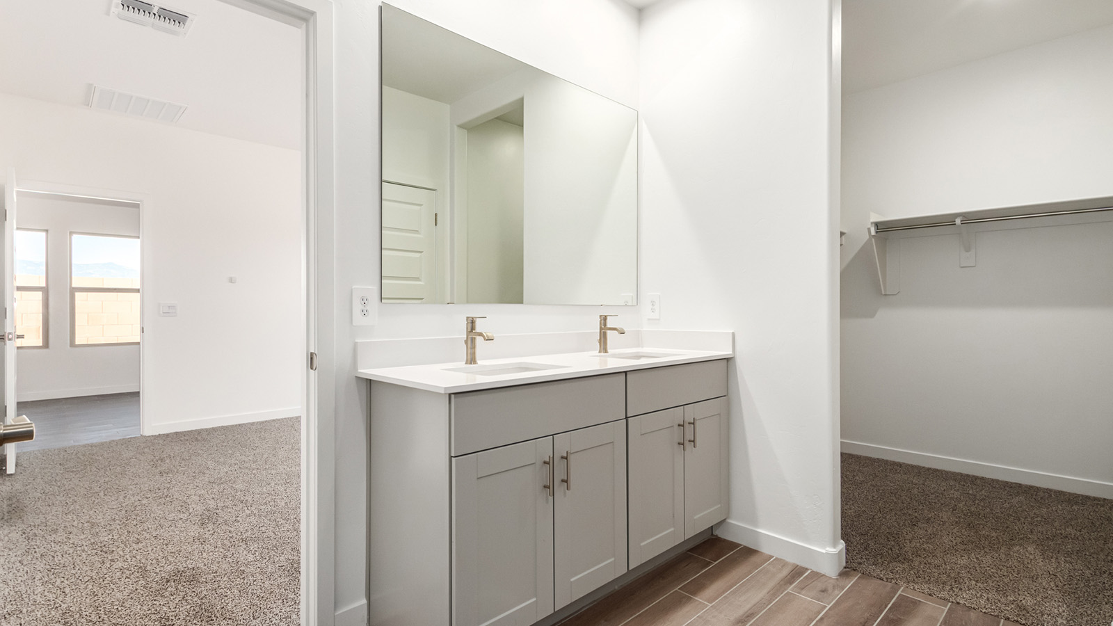 Snuggled within the serene surroundings of Sycamore Vista, The Baxter offers a blend of comfort and convenience, making it a perfect fit for modern living. Spanning 1,423 square feet, this thoughtfully crafted single-story home features three bedrooms, two bathrooms, and a two-car garage, all within the picturesque foothills of the Santa Rita Mountains.  As you step onto the welcoming front porch and enter through the foyer, you’re greeted by a spacious and open floor plan that flows effortlessly into the heart of the home. The great room is designed for both relaxation and socializing, seamlessly connecting to the dining area and kitchen. The kitchen is a culinary enthusiast's dream, featuring sleek quartz countertops, a central island, and Shaker-style cabinetry, all designed to offer ample storage and a stylish backdrop for your cooking adventures. The adjacent pantry ensures that all your essentials are within easy reach, making meal prep both efficient and enjoyable.  The primary bedroom, located at the rear of the home for enhanced privacy, serves as a peaceful retreat. It includes a spacious walk-in closet and an en-suite bathroom equipped with dual vanities and a luxurious shower. The two additional bedrooms are thoughtfully positioned near the front of the home, sharing a full bathroom, making it ideal for families or guests.  Outdoor living is a key feature of The Baxter, with a covered patio that extends from the dining area, offering the perfect space to enjoy Tucson’s stunning sunsets or host a weekend barbecue.  Living in Sycamore Vista means you’re part of a community that values both convenience and quality of life. Each home in this community comes with beautifully landscaped front yards, equipped with auto drip irrigation systems and soft water loops, enhancing the beauty and functionality of your outdoor space. Additionally, Sycamore Vista homes are energy-efficient, featuring DOE Zero Energy Ready standards, including spray foam insulation, tankless water heaters, and LED lighting throughout, ensuring lower energy costs and a reduced environmental footprint.  Experience the best of Arizona living at Sycamore Vista, where The Baxter offers the perfect blend of modern amenities, quality craftsmanship, and the natural beauty of the Santa Rita Mountains, creating a place you’ll be proud to call home.  *Images shown are for reference only. They depict the Baxter model home and may not represent the actual home.