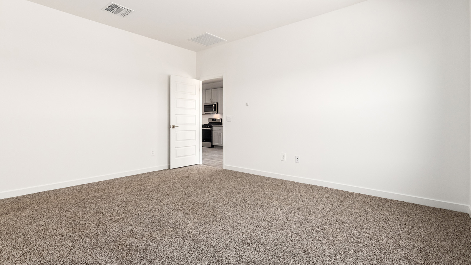 Snuggled within the serene surroundings of Sycamore Vista, The Baxter offers a blend of comfort and convenience, making it a perfect fit for modern living. Spanning 1,423 square feet, this thoughtfully crafted single-story home features three bedrooms, two bathrooms, and a two-car garage, all within the picturesque foothills of the Santa Rita Mountains.  As you step onto the welcoming front porch and enter through the foyer, you’re greeted by a spacious and open floor plan that flows effortlessly into the heart of the home. The great room is designed for both relaxation and socializing, seamlessly connecting to the dining area and kitchen. The kitchen is a culinary enthusiast's dream, featuring sleek quartz countertops, a central island, and Shaker-style cabinetry, all designed to offer ample storage and a stylish backdrop for your cooking adventures. The adjacent pantry ensures that all your essentials are within easy reach, making meal prep both efficient and enjoyable.  The primary bedroom, located at the rear of the home for enhanced privacy, serves as a peaceful retreat. It includes a spacious walk-in closet and an en-suite bathroom equipped with dual vanities and a luxurious shower. The two additional bedrooms are thoughtfully positioned near the front of the home, sharing a full bathroom, making it ideal for families or guests.  Outdoor living is a key feature of The Baxter, with a covered patio that extends from the dining area, offering the perfect space to enjoy Tucson’s stunning sunsets or host a weekend barbecue.  Living in Sycamore Vista means you’re part of a community that values both convenience and quality of life. Each home in this community comes with beautifully landscaped front yards, equipped with auto drip irrigation systems and soft water loops, enhancing the beauty and functionality of your outdoor space. Additionally, Sycamore Vista homes are energy-efficient, featuring DOE Zero Energy Ready standards, including spray foam insulation, tankless water heaters, and LED lighting throughout, ensuring lower energy costs and a reduced environmental footprint.  Experience the best of Arizona living at Sycamore Vista, where The Baxter offers the perfect blend of modern amenities, quality craftsmanship, and the natural beauty of the Santa Rita Mountains, creating a place you’ll be proud to call home.  *Images shown are for reference only. They depict the Baxter model home and may not represent the actual home.