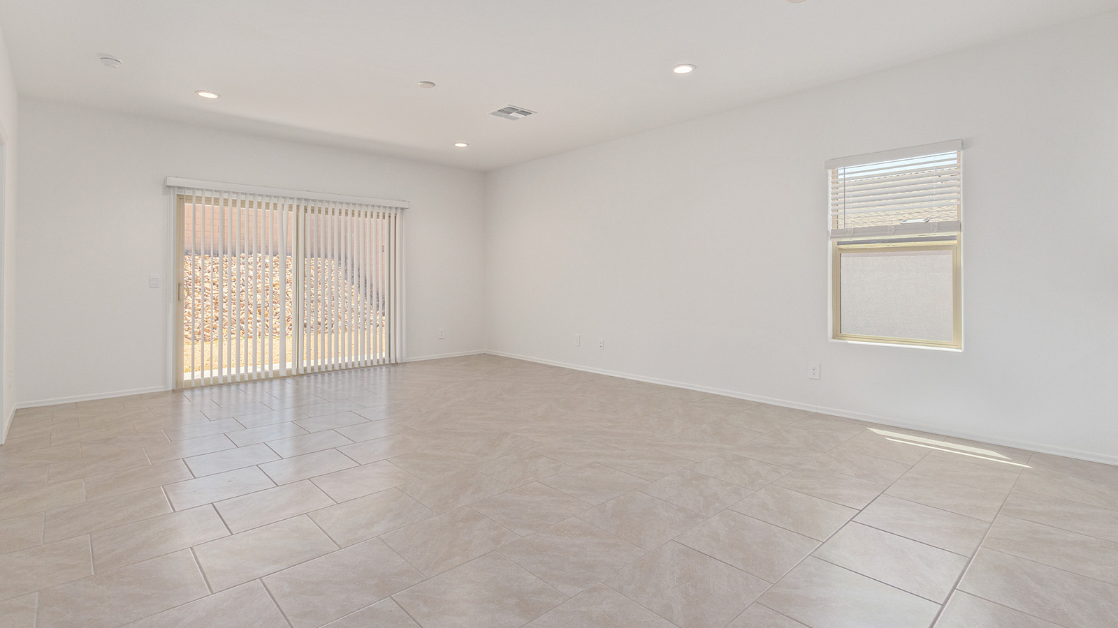 Step into The Elgin, a spacious single-story home located in the scenic Sycamore Vista community in Vail, AZ. This floor plan offers 1,635 square feet of well-planned living space, perfect for those who appreciate both comfort and functionality. With four bedrooms, two bathrooms, and a 3-car garage, The Elgin provides the ideal setting for modern living amidst the beauty of the Santa Rita Mountains.  As you enter through the inviting front porch, you’re welcomed by an open and airy floor plan that flows effortlessly from one room to the next. The heart of the home is the expansive great room, seamlessly connected to the dining area and kitchen, making it ideal for everyday living and entertaining. The kitchen is a chef’s delight, featuring a large island with a breakfast bar, granite countertops, and Shaker-style cabinetry, offering ample storage and workspace. The walk-in pantry and adjacent utility room add convenience and organization to your culinary adventures.  The primary suite is designed with relaxation in mind, offering a spacious bedroom with a walk-in closet and a private en-suite bathroom. This personal haven is positioned at the rear of the home for added privacy. The three additional bedrooms are located towards the front of the home, providing flexibility for guests, family, or a home office setup. A second full bathroom is conveniently situated near these bedrooms.  One of the standout features of The Elgin is the 3-car garage, providing plenty of room for vehicles, storage, or even a workshop. Whether you have multiple cars, recreational vehicles, or just need extra space, this garage has you covered.  Step outside to enjoy your covered patio, which is perfect for outdoor dining, lounging, or simply taking in the stunning Arizona sunsets. The large backyard provides endless possibilities for gardening, play, or creating your own outdoor oasis.  Living at Sycamore Vista means enjoying a community that balances modern amenities with natural beauty. Your home includes luxury finishes such as staggered wood-look ceramic tile flooring throughout most areas, granite countertops, and energy-efficient features like spray foam insulation and tankless water heaters. Additionally, each home in the community comes equipped with a Home is Connected® Smart Home package, offering conveniences like a smart thermostat, video doorbell, keyless entry, a wifi-enabled garage door opener and more.  Sycamore Vista’s prime location in the Vail School District makes it a great choice for families. With schools like Sycamore Elementary and Corona Foothills Middle School nearby, you’ll have peace of mind knowing your children are receiving a quality education. The community’s higher elevation offers cooler summer temperatures and spectacular night skies, making it a perfect spot for stargazing.  Experience the perfect blend of rural charm and modern convenience at Sycamore Vista, where The Elgin offers a space that’s more than just a house—it’s a home designed to grow with you and your family.  *Images shown are for reference only. They depict the Elgin model home and may not represent the actual home.