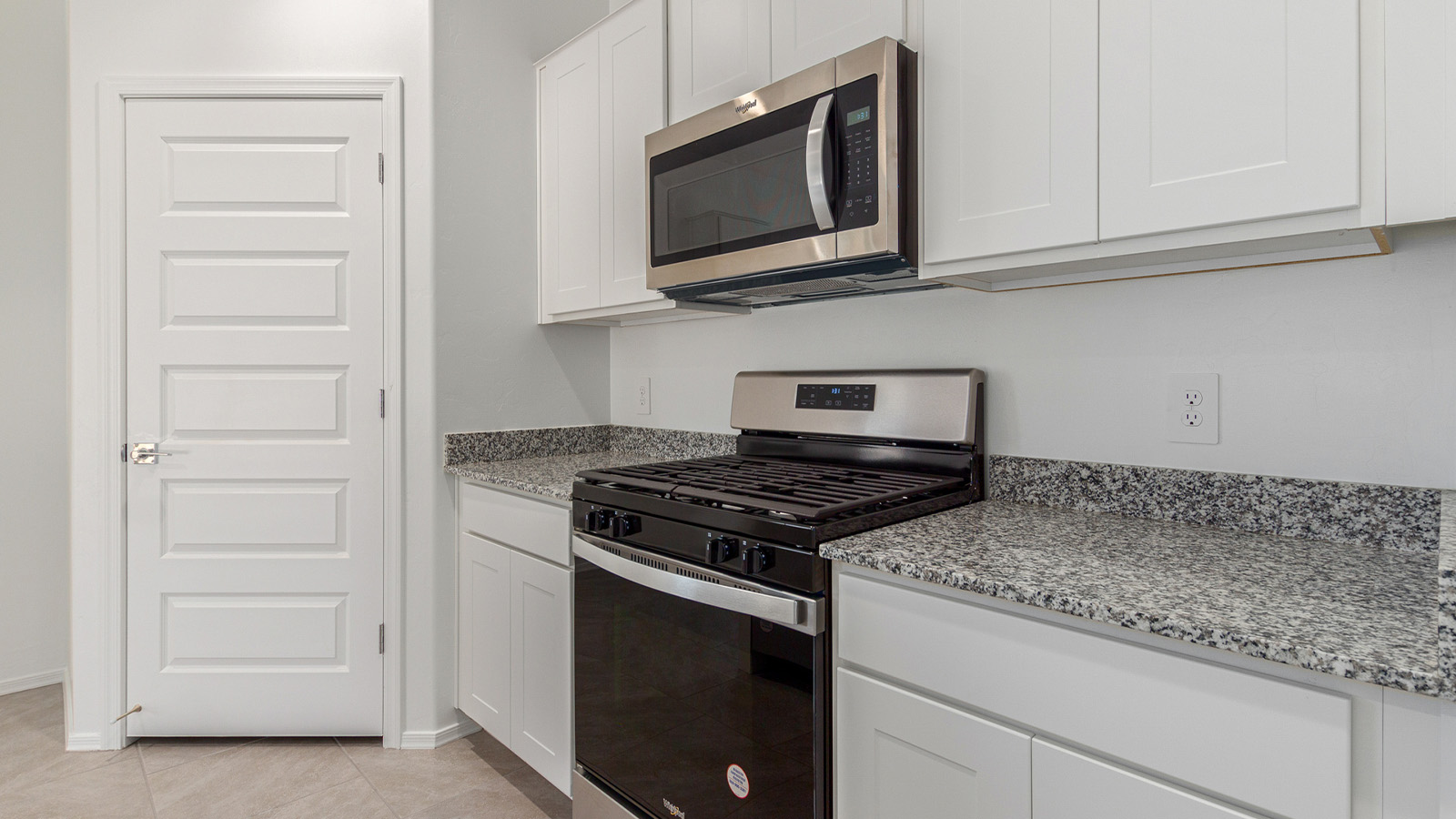 Step into The Elgin, a spacious single-story home located in the scenic Sycamore Vista community in Vail, AZ. This floor plan offers 1,635 square feet of well-planned living space, perfect for those who appreciate both comfort and functionality. With four bedrooms, two bathrooms, and a 3-car garage, The Elgin provides the ideal setting for modern living amidst the beauty of the Santa Rita Mountains.  As you enter through the inviting front porch, you’re welcomed by an open and airy floor plan that flows effortlessly from one room to the next. The heart of the home is the expansive great room, seamlessly connected to the dining area and kitchen, making it ideal for everyday living and entertaining. The kitchen is a chef’s delight, featuring a large island with a breakfast bar, granite countertops, and Shaker-style cabinetry, offering ample storage and workspace. The walk-in pantry and adjacent utility room add convenience and organization to your culinary adventures.  The primary suite is designed with relaxation in mind, offering a spacious bedroom with a walk-in closet and a private en-suite bathroom. This personal haven is positioned at the rear of the home for added privacy. The three additional bedrooms are located towards the front of the home, providing flexibility for guests, family, or a home office setup. A second full bathroom is conveniently situated near these bedrooms.  One of the standout features of The Elgin is the 3-car garage, providing plenty of room for vehicles, storage, or even a workshop. Whether you have multiple cars, recreational vehicles, or just need extra space, this garage has you covered.  Step outside to enjoy your covered patio, which is perfect for outdoor dining, lounging, or simply taking in the stunning Arizona sunsets. The large backyard provides endless possibilities for gardening, play, or creating your own outdoor oasis.  Living at Sycamore Vista means enjoying a community that balances modern amenities with natural beauty. Your home includes luxury finishes such as staggered wood-look ceramic tile flooring throughout most areas, granite countertops, and energy-efficient features like spray foam insulation and tankless water heaters. Additionally, each home in the community comes equipped with a Home is Connected® Smart Home package, offering conveniences like a smart thermostat, video doorbell, keyless entry, a wifi-enabled garage door opener and more.  Sycamore Vista’s prime location in the Vail School District makes it a great choice for families. With schools like Sycamore Elementary and Corona Foothills Middle School nearby, you’ll have peace of mind knowing your children are receiving a quality education. The community’s higher elevation offers cooler summer temperatures and spectacular night skies, making it a perfect spot for stargazing.  Experience the perfect blend of rural charm and modern convenience at Sycamore Vista, where The Elgin offers a space that’s more than just a house—it’s a home designed to grow with you and your family.  *Images shown are for reference only. They depict the Elgin model home and may not represent the actual home.