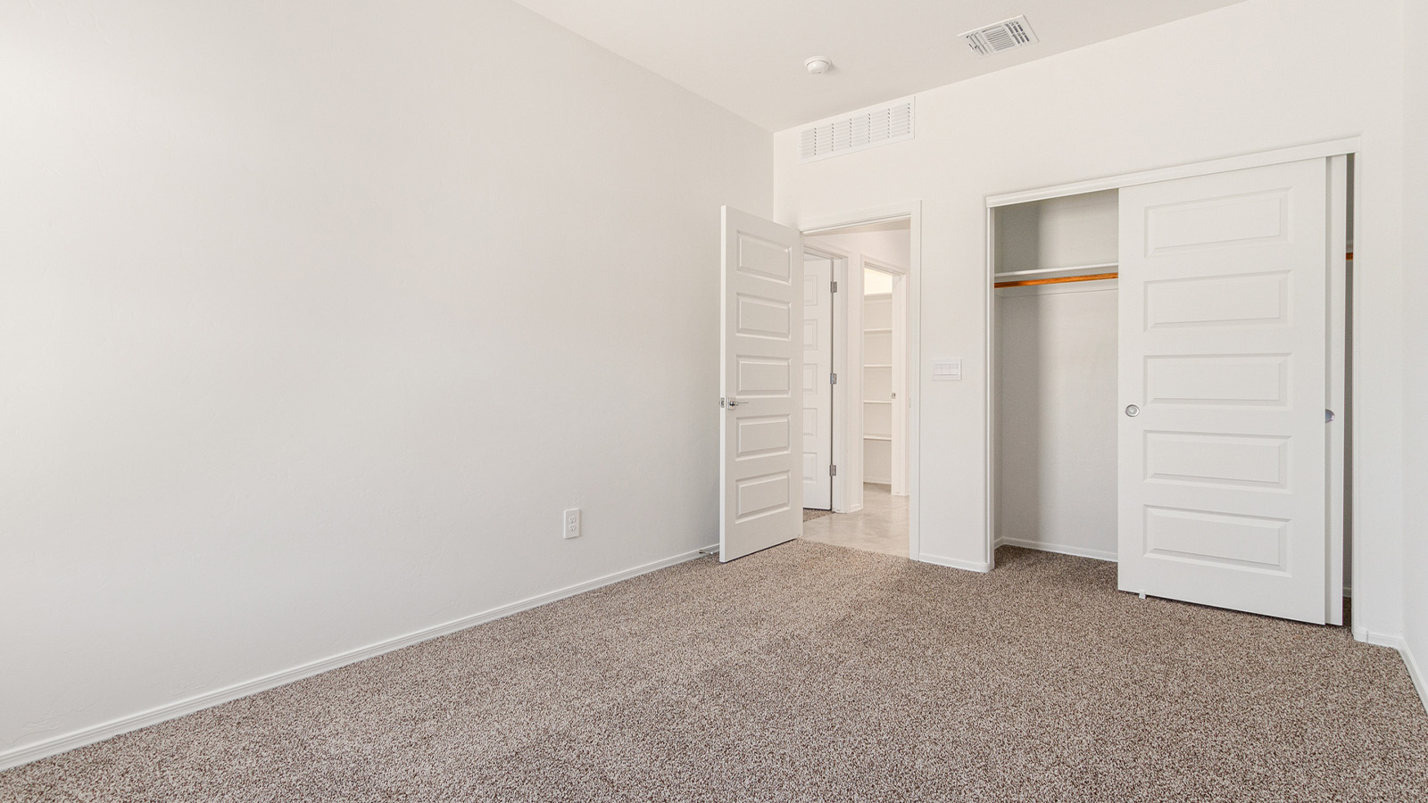 Step into The Elgin, a spacious single-story home located in the scenic Sycamore Vista community in Vail, AZ. This floor plan offers 1,635 square feet of well-planned living space, perfect for those who appreciate both comfort and functionality. With four bedrooms, two bathrooms, and a 3-car garage, The Elgin provides the ideal setting for modern living amidst the beauty of the Santa Rita Mountains.  As you enter through the inviting front porch, you’re welcomed by an open and airy floor plan that flows effortlessly from one room to the next. The heart of the home is the expansive great room, seamlessly connected to the dining area and kitchen, making it ideal for everyday living and entertaining. The kitchen is a chef’s delight, featuring a large island with a breakfast bar, granite countertops, and Shaker-style cabinetry, offering ample storage and workspace. The walk-in pantry and adjacent utility room add convenience and organization to your culinary adventures.  The primary suite is designed with relaxation in mind, offering a spacious bedroom with a walk-in closet and a private en-suite bathroom. This personal haven is positioned at the rear of the home for added privacy. The three additional bedrooms are located towards the front of the home, providing flexibility for guests, family, or a home office setup. A second full bathroom is conveniently situated near these bedrooms.  One of the standout features of The Elgin is the 3-car garage, providing plenty of room for vehicles, storage, or even a workshop. Whether you have multiple cars, recreational vehicles, or just need extra space, this garage has you covered.  Step outside to enjoy your covered patio, which is perfect for outdoor dining, lounging, or simply taking in the stunning Arizona sunsets. The large backyard provides endless possibilities for gardening, play, or creating your own outdoor oasis.  Living at Sycamore Vista means enjoying a community that balances modern amenities with natural beauty. Your home includes luxury finishes such as staggered wood-look ceramic tile flooring throughout most areas, granite countertops, and energy-efficient features like spray foam insulation and tankless water heaters. Additionally, each home in the community comes equipped with a Home is Connected® Smart Home package, offering conveniences like a smart thermostat, video doorbell, keyless entry, a wifi-enabled garage door opener and more.  Sycamore Vista’s prime location in the Vail School District makes it a great choice for families. With schools like Sycamore Elementary and Corona Foothills Middle School nearby, you’ll have peace of mind knowing your children are receiving a quality education. The community’s higher elevation offers cooler summer temperatures and spectacular night skies, making it a perfect spot for stargazing.  Experience the perfect blend of rural charm and modern convenience at Sycamore Vista, where The Elgin offers a space that’s more than just a house—it’s a home designed to grow with you and your family.  *Images shown are for reference only. They depict the Elgin model home and may not represent the actual home.