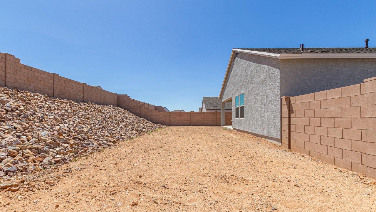 Step into The Elgin, a spacious single-story home located in the scenic Sycamore Vista community in Vail, AZ. This floor plan offers 1,635 square feet of well-planned living space, perfect for those who appreciate both comfort and functionality. With four bedrooms, two bathrooms, and a 3-car garage, The Elgin provides the ideal setting for modern living amidst the beauty of the Santa Rita Mountains.  As you enter through the inviting front porch, you’re welcomed by an open and airy floor plan that flows effortlessly from one room to the next. The heart of the home is the expansive great room, seamlessly connected to the dining area and kitchen, making it ideal for everyday living and entertaining. The kitchen is a chef’s delight, featuring a large island with a breakfast bar, granite countertops, and Shaker-style cabinetry, offering ample storage and workspace. The walk-in pantry and adjacent utility room add convenience and organization to your culinary adventures.  The primary suite is designed with relaxation in mind, offering a spacious bedroom with a walk-in closet and a private en-suite bathroom. This personal haven is positioned at the rear of the home for added privacy. The three additional bedrooms are located towards the front of the home, providing flexibility for guests, family, or a home office setup. A second full bathroom is conveniently situated near these bedrooms.  One of the standout features of The Elgin is the 3-car garage, providing plenty of room for vehicles, storage, or even a workshop. Whether you have multiple cars, recreational vehicles, or just need extra space, this garage has you covered.  Step outside to enjoy your covered patio, which is perfect for outdoor dining, lounging, or simply taking in the stunning Arizona sunsets. The large backyard provides endless possibilities for gardening, play, or creating your own outdoor oasis.  Living at Sycamore Vista means enjoying a community that balances modern amenities with natural beauty. Your home includes luxury finishes such as staggered wood-look ceramic tile flooring throughout most areas, granite countertops, and energy-efficient features like spray foam insulation and tankless water heaters. Additionally, each home in the community comes equipped with a Home is Connected® Smart Home package, offering conveniences like a smart thermostat, video doorbell, keyless entry, a wifi-enabled garage door opener and more.  Sycamore Vista’s prime location in the Vail School District makes it a great choice for families. With schools like Sycamore Elementary and Corona Foothills Middle School nearby, you’ll have peace of mind knowing your children are receiving a quality education. The community’s higher elevation offers cooler summer temperatures and spectacular night skies, making it a perfect spot for stargazing.  Experience the perfect blend of rural charm and modern convenience at Sycamore Vista, where The Elgin offers a space that’s more than just a house—it’s a home designed to grow with you and your family.  *Images shown are for reference only. They depict the Elgin model home and may not represent the actual home.