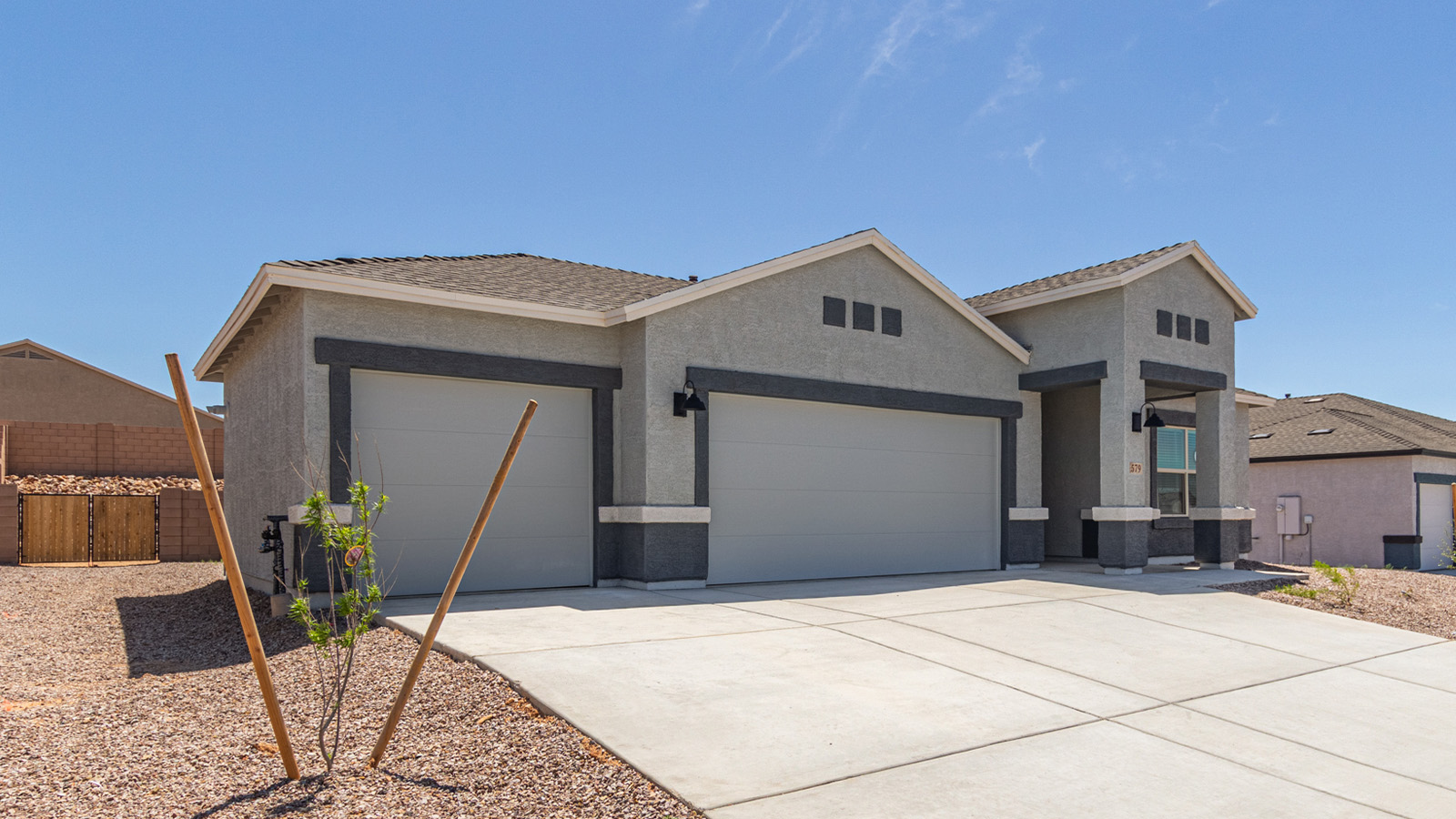 Step into The Elgin, a spacious single-story home located in the scenic Sycamore Vista community in Vail, AZ. This floor plan offers 1,635 square feet of well-planned living space, perfect for those who appreciate both comfort and functionality. With four bedrooms, two bathrooms, and a 3-car garage, The Elgin provides the ideal setting for modern living amidst the beauty of the Santa Rita Mountains.  As you enter through the inviting front porch, you’re welcomed by an open and airy floor plan that flows effortlessly from one room to the next. The heart of the home is the expansive great room, seamlessly connected to the dining area and kitchen, making it ideal for everyday living and entertaining. The kitchen is a chef’s delight, featuring a large island with a breakfast bar, granite countertops, and Shaker-style cabinetry, offering ample storage and workspace. The walk-in pantry and adjacent utility room add convenience and organization to your culinary adventures.  The primary suite is designed with relaxation in mind, offering a spacious bedroom with a walk-in closet and a private en-suite bathroom. This personal haven is positioned at the rear of the home for added privacy. The three additional bedrooms are located towards the front of the home, providing flexibility for guests, family, or a home office setup. A second full bathroom is conveniently situated near these bedrooms.  One of the standout features of The Elgin is the 3-car garage, providing plenty of room for vehicles, storage, or even a workshop. Whether you have multiple cars, recreational vehicles, or just need extra space, this garage has you covered.  Step outside to enjoy your covered patio, which is perfect for outdoor dining, lounging, or simply taking in the stunning Arizona sunsets. The large backyard provides endless possibilities for gardening, play, or creating your own outdoor oasis.  Living at Sycamore Vista means enjoying a community that balances modern amenities with natural beauty. Your home includes luxury finishes such as staggered wood-look ceramic tile flooring throughout most areas, granite countertops, and energy-efficient features like spray foam insulation and tankless water heaters. Additionally, each home in the community comes equipped with a Home is Connected® Smart Home package, offering conveniences like a smart thermostat, video doorbell, keyless entry, a wifi-enabled garage door opener and more.  Sycamore Vista’s prime location in the Vail School District makes it a great choice for families. With schools like Sycamore Elementary and Corona Foothills Middle School nearby, you’ll have peace of mind knowing your children are receiving a quality education. The community’s higher elevation offers cooler summer temperatures and spectacular night skies, making it a perfect spot for stargazing.  Experience the perfect blend of rural charm and modern convenience at Sycamore Vista, where The Elgin offers a space that’s more than just a house—it’s a home designed to grow with you and your family.