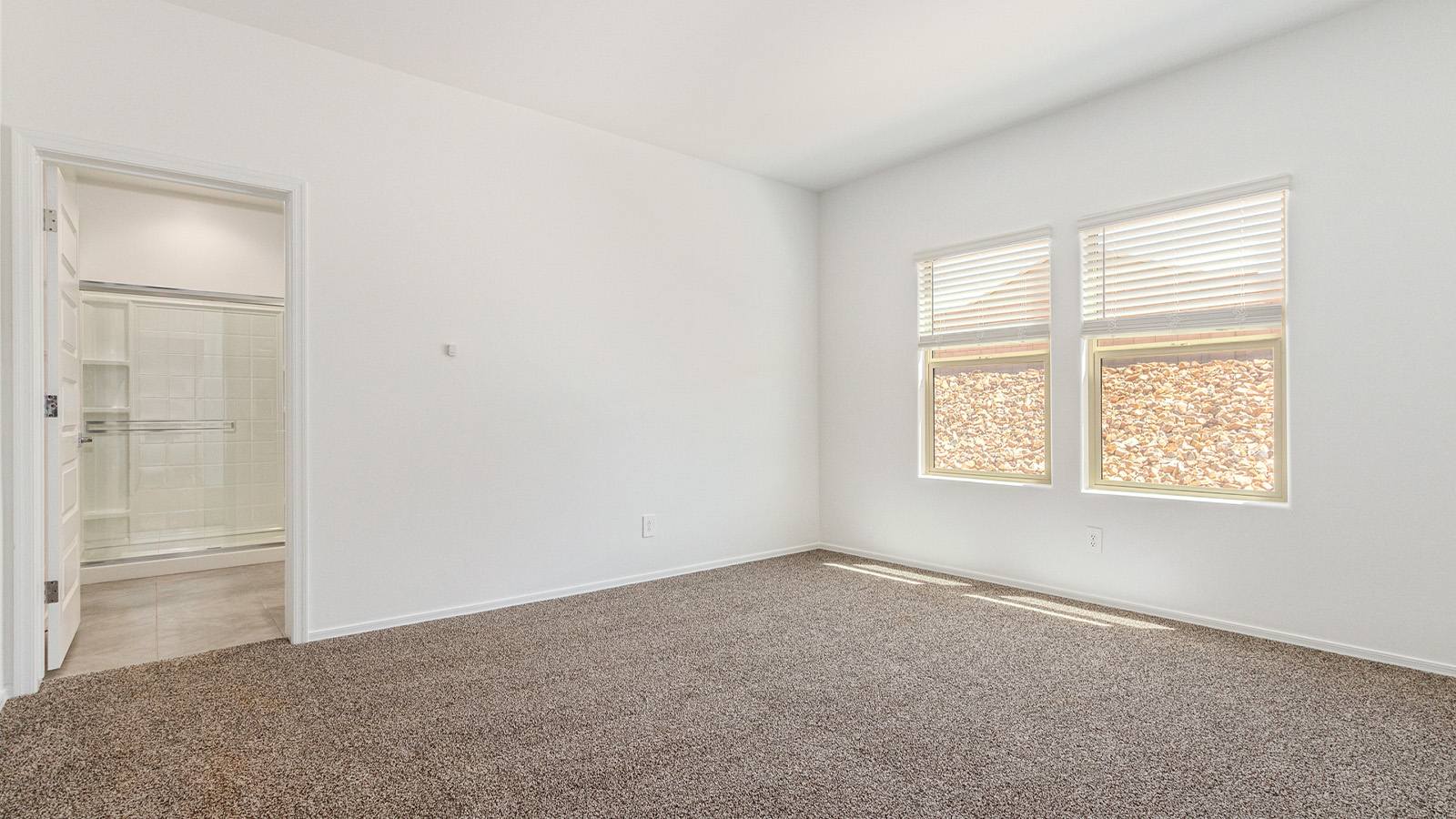 Step into The Elgin, a spacious single-story home located in the scenic Sycamore Vista community in Vail, AZ. This floor plan offers 1,635 square feet of well-planned living space, perfect for those who appreciate both comfort and functionality. With four bedrooms, two bathrooms, and a 3-car garage, The Elgin provides the ideal setting for modern living amidst the beauty of the Santa Rita Mountains.  As you enter through the inviting front porch, you’re welcomed by an open and airy floor plan that flows effortlessly from one room to the next. The heart of the home is the expansive great room, seamlessly connected to the dining area and kitchen, making it ideal for everyday living and entertaining. The kitchen is a chef’s delight, featuring a large island with a breakfast bar, granite countertops, and Shaker-style cabinetry, offering ample storage and workspace. The walk-in pantry and adjacent utility room add convenience and organization to your culinary adventures.  The primary suite is designed with relaxation in mind, offering a spacious bedroom with a walk-in closet and a private en-suite bathroom. This personal haven is positioned at the rear of the home for added privacy. The three additional bedrooms are located towards the front of the home, providing flexibility for guests, family, or a home office setup. A second full bathroom is conveniently situated near these bedrooms.  One of the standout features of The Elgin is the 3-car garage, providing plenty of room for vehicles, storage, or even a workshop. Whether you have multiple cars, recreational vehicles, or just need extra space, this garage has you covered.  Step outside to enjoy your covered patio, which is perfect for outdoor dining, lounging, or simply taking in the stunning Arizona sunsets. The large backyard provides endless possibilities for gardening, play, or creating your own outdoor oasis.  Living at Sycamore Vista means enjoying a community that balances modern amenities with natural beauty. Your home includes luxury finishes such as staggered wood-look ceramic tile flooring throughout most areas, granite countertops, and energy-efficient features like spray foam insulation and tankless water heaters. Additionally, each home in the community comes equipped with a Home is Connected® Smart Home package, offering conveniences like a smart thermostat, video doorbell, keyless entry, a wifi-enabled garage door opener and more.  Sycamore Vista’s prime location in the Vail School District makes it a great choice for families. With schools like Sycamore Elementary and Corona Foothills Middle School nearby, you’ll have peace of mind knowing your children are receiving a quality education. The community’s higher elevation offers cooler summer temperatures and spectacular night skies, making it a perfect spot for stargazing.  Experience the perfect blend of rural charm and modern convenience at Sycamore Vista, where The Elgin offers a space that’s more than just a house—it’s a home designed to grow with you and your family.