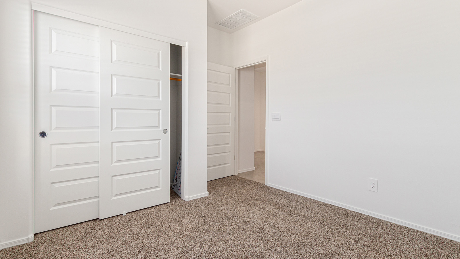 Step into The Elgin, a spacious single-story home located in the scenic Sycamore Vista community in Vail, AZ. This floor plan offers 1,635 square feet of well-planned living space, perfect for those who appreciate both comfort and functionality. With four bedrooms, two bathrooms, and a 3-car garage, The Elgin provides the ideal setting for modern living amidst the beauty of the Santa Rita Mountains.  As you enter through the inviting front porch, you’re welcomed by an open and airy floor plan that flows effortlessly from one room to the next. The heart of the home is the expansive great room, seamlessly connected to the dining area and kitchen, making it ideal for everyday living and entertaining. The kitchen is a chef’s delight, featuring a large island with a breakfast bar, granite countertops, and Shaker-style cabinetry, offering ample storage and workspace. The walk-in pantry and adjacent utility room add convenience and organization to your culinary adventures.  The primary suite is designed with relaxation in mind, offering a spacious bedroom with a walk-in closet and a private en-suite bathroom. This personal haven is positioned at the rear of the home for added privacy. The three additional bedrooms are located towards the front of the home, providing flexibility for guests, family, or a home office setup. A second full bathroom is conveniently situated near these bedrooms.  One of the standout features of The Elgin is the 3-car garage, providing plenty of room for vehicles, storage, or even a workshop. Whether you have multiple cars, recreational vehicles, or just need extra space, this garage has you covered.  Step outside to enjoy your covered patio, which is perfect for outdoor dining, lounging, or simply taking in the stunning Arizona sunsets. The large backyard provides endless possibilities for gardening, play, or creating your own outdoor oasis.  Living at Sycamore Vista means enjoying a community that balances modern amenities with natural beauty. Your home includes luxury finishes such as staggered wood-look ceramic tile flooring throughout most areas, granite countertops, and energy-efficient features like spray foam insulation and tankless water heaters. Additionally, each home in the community comes equipped with a Home is Connected® Smart Home package, offering conveniences like a smart thermostat, video doorbell, keyless entry, a wifi-enabled garage door opener and more.  Sycamore Vista’s prime location in the Vail School District makes it a great choice for families. With schools like Sycamore Elementary and Corona Foothills Middle School nearby, you’ll have peace of mind knowing your children are receiving a quality education. The community’s higher elevation offers cooler summer temperatures and spectacular night skies, making it a perfect spot for stargazing.  Experience the perfect blend of rural charm and modern convenience at Sycamore Vista, where The Elgin offers a space that’s more than just a house—it’s a home designed to grow with you and your family.