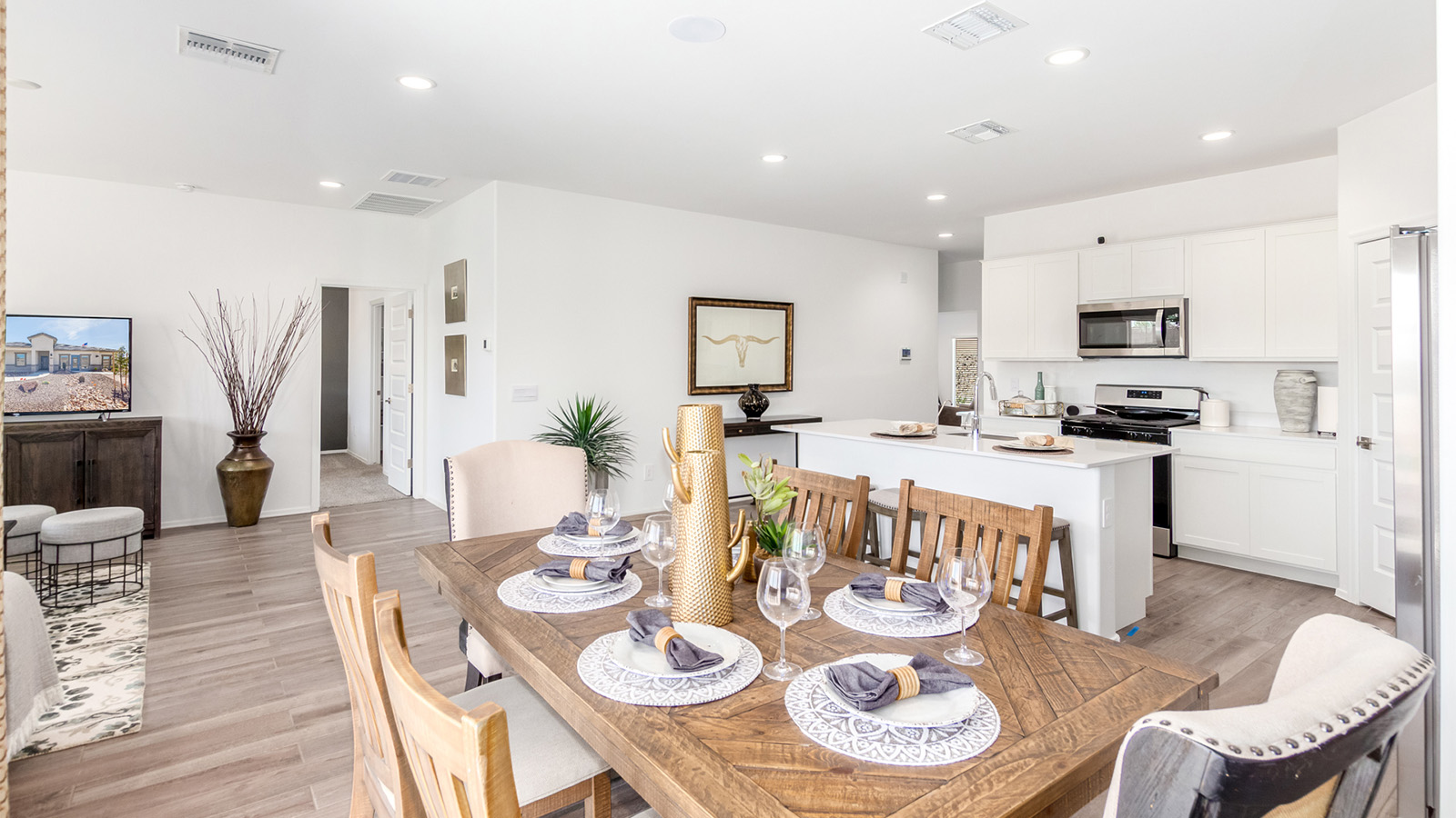 Experience the charm of The Cali, located within the peaceful Sycamore Vista community in the serene foothills of the Santa Rita Mountains, Arizona. This thoughtfully laid-out, single-story home offers 1,823 square feet of versatile living space designed to meet the needs of modern families.  Step into the inviting entryway, where you're welcomed by a spacious great room that serves as the heart of the home. The open-concept design connects the great room to the dining area and kitchen, creating a harmonious flow that's perfect for both entertaining and daily living. The kitchen is a true culinary haven, featuring a large island, quartz countertops, and ample storage space with a walk-in pantry.  The Cali's four bedrooms are designed with relaxation in mind. The primary suite, tucked away from the other bedrooms, offers a private oasis complete with a walk-in closet and en-suite bathroom. The additional three bedrooms share a well-equipped bathroom and are situated to provide comfort and privacy for family members or guests.  Adding to the home's appeal are the premium standard features that come included in every Cali at Sycamore Vista. Enjoy the elegance of staggered wood-look ceramic tile flooring throughout the main living areas, complemented by Shaker-style cabinetry in the kitchen and bathrooms. The kitchen is further enhanced by an open single basin stainless steel sink paired with a water filtration system, making both cooking and cleanup a breeze. The energy-efficient design includes spray foam insulation, a tankless water heater, and LED lighting throughout, all contributing to a more sustainable lifestyle.  Outdoor living is a breeze with the covered patio, easily accessible from the dining room, providing the perfect spot for morning coffee or evening gatherings. The three-car garage offers plenty of space for vehicles and storage, ensuring that everything you need is within easy reach.  Sycamore Vista's location offers a unique blend of tranquility and convenience, making The Cali an ideal choice for those seeking a peaceful retreat with easy access to modern amenities. Whether you're relaxing indoors or enjoying the outdoor beauty of Arizona, The Cali is a home that combines style, comfort, and functionality in every detail.  *Images shown are for reference only. They depict the Cali sales model home and may not represent the actual home.