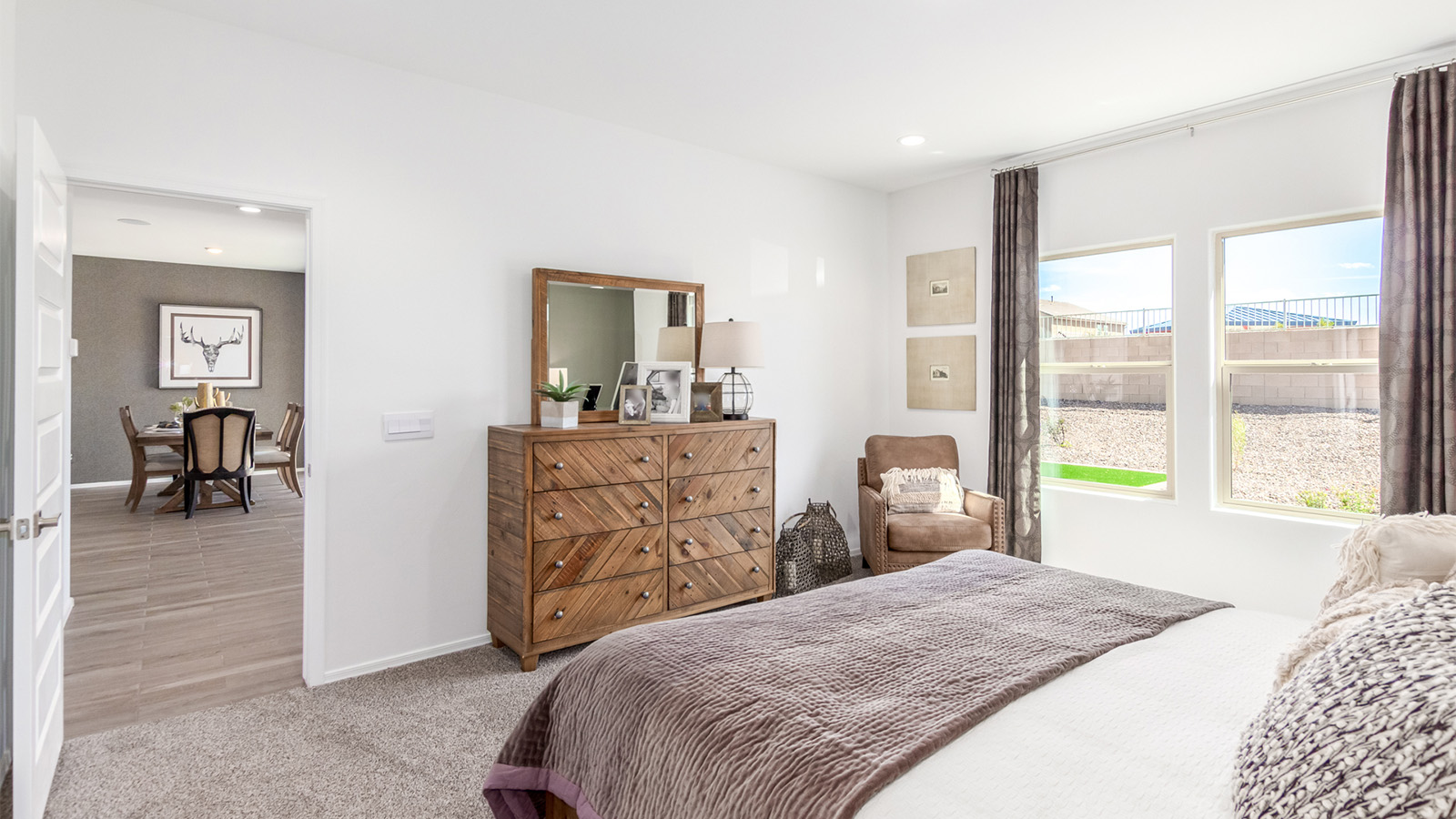 Experience the charm of The Cali, located within the peaceful Sycamore Vista community in the serene foothills of the Santa Rita Mountains, Arizona. This thoughtfully laid-out, single-story home offers 1,823 square feet of versatile living space designed to meet the needs of modern families.  Step into the inviting entryway, where you're welcomed by a spacious great room that serves as the heart of the home. The open-concept design connects the great room to the dining area and kitchen, creating a harmonious flow that's perfect for both entertaining and daily living. The kitchen is a true culinary haven, featuring a large island, quartz countertops, and ample storage space with a walk-in pantry.  The Cali's four bedrooms are designed with relaxation in mind. The primary suite, tucked away from the other bedrooms, offers a private oasis complete with a walk-in closet and en-suite bathroom. The additional three bedrooms share a well-equipped bathroom and are situated to provide comfort and privacy for family members or guests.  Adding to the home's appeal are the premium standard features that come included in every Cali at Sycamore Vista. Enjoy the elegance of staggered wood-look ceramic tile flooring throughout the main living areas, complemented by Shaker-style cabinetry in the kitchen and bathrooms. The kitchen is further enhanced by an open single basin stainless steel sink paired with a water filtration system, making both cooking and cleanup a breeze. The energy-efficient design includes spray foam insulation, a tankless water heater, and LED lighting throughout, all contributing to a more sustainable lifestyle.  Outdoor living is a breeze with the covered patio, easily accessible from the dining room, providing the perfect spot for morning coffee or evening gatherings. The three-car garage offers plenty of space for vehicles and storage, ensuring that everything you need is within easy reach.  Sycamore Vista's location offers a unique blend of tranquility and convenience, making The Cali an ideal choice for those seeking a peaceful retreat with easy access to modern amenities. Whether you're relaxing indoors or enjoying the outdoor beauty of Arizona, The Cali is a home that combines style, comfort, and functionality in every detail.  *Images shown are for reference only. They depict the Cali sales model home and may not represent the actual home.