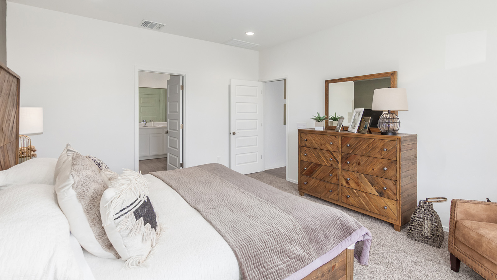 Experience the charm of The Cali, located within the peaceful Sycamore Vista community in the serene foothills of the Santa Rita Mountains, Arizona. This thoughtfully laid-out, single-story home offers 1,823 square feet of versatile living space designed to meet the needs of modern families.  Step into the inviting entryway, where you're welcomed by a spacious great room that serves as the heart of the home. The open-concept design connects the great room to the dining area and kitchen, creating a harmonious flow that's perfect for both entertaining and daily living. The kitchen is a true culinary haven, featuring a large island, quartz countertops, and ample storage space with a walk-in pantry.  The Cali's four bedrooms are designed with relaxation in mind. The primary suite, tucked away from the other bedrooms, offers a private oasis complete with a walk-in closet and en-suite bathroom. The additional three bedrooms share a well-equipped bathroom and are situated to provide comfort and privacy for family members or guests.  Adding to the home's appeal are the premium standard features that come included in every Cali at Sycamore Vista. Enjoy the elegance of staggered wood-look ceramic tile flooring throughout the main living areas, complemented by Shaker-style cabinetry in the kitchen and bathrooms. The kitchen is further enhanced by an open single basin stainless steel sink paired with a water filtration system, making both cooking and cleanup a breeze. The energy-efficient design includes spray foam insulation, a tankless water heater, and LED lighting throughout, all contributing to a more sustainable lifestyle.  Outdoor living is a breeze with the covered patio, easily accessible from the dining room, providing the perfect spot for morning coffee or evening gatherings. The three-car garage offers plenty of space for vehicles and storage, ensuring that everything you need is within easy reach.  Sycamore Vista's location offers a unique blend of tranquility and convenience, making The Cali an ideal choice for those seeking a peaceful retreat with easy access to modern amenities. Whether you're relaxing indoors or enjoying the outdoor beauty of Arizona, The Cali is a home that combines style, comfort, and functionality in every detail.  *Images shown are for reference only. They depict the Cali sales model home and may not represent the actual home.