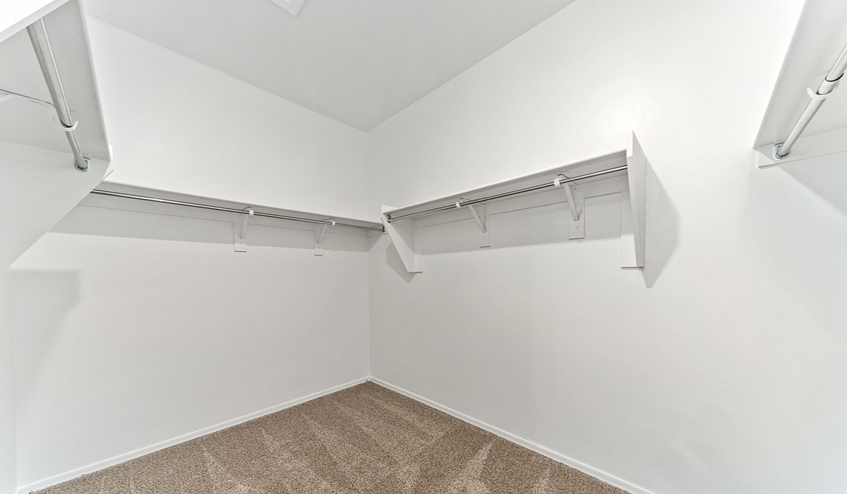 Welcome to the Kingston, a premier new home design situated in the picturesque Sycamore Vista community in Vail, Arizona. With an expansive 2,051 square feet of living space, this single-story home offers four bedrooms, two bathrooms, and a two-car garage.  As you step inside, you are greeted by an inviting entryway that flows seamlessly into a heart of the home. The open-concept kitchen, equipped with a center island, modern appliances, and ample pantry space, makes it ideal for culinary adventures. Adjacent to the kitchen, the dining room offers easy access to the covered patio, where you can enjoy outdoor dining or simply relax in the tranquility of your private backyard.  The Kingston’s thoughtful layout ensures that every bedroom offers comfort and privacy. The primary suite, located at the rear of the home, features a large walk-in closet and an en-suite bathroom. The additional bedrooms are thoughtfully arranged to provide flexibility, whether you need a guest room, home office, or space for hobbies.  The Kingston is built with a focus on energy efficiency, featuring top-of-the-line insulation, energy-efficient appliances, and a smart home package that includes an automated thermostat, keyless entry, a Wi-Fi-enabled garage door opener, and more. This modern home not only offers comfort but also provides peace of mind with its energy-saving features and enhanced security systems.  Residents of Sycamore Vista enjoy a harmonious blend of rural tranquility and convenient urban access. With proximity to outdoor attractions like Coronado National Forest and Colossal Cave Mountain Park, as well as nearby schools and major employers, Sycamore Vista provides a unique living experience where nature and modern living coexist.  The Kingston at Sycamore Vista is more than just a house—it's a place to create lasting memories and live your best life.  *Images shown are for reference only. They depict the sales model home and may not represent the actual home.